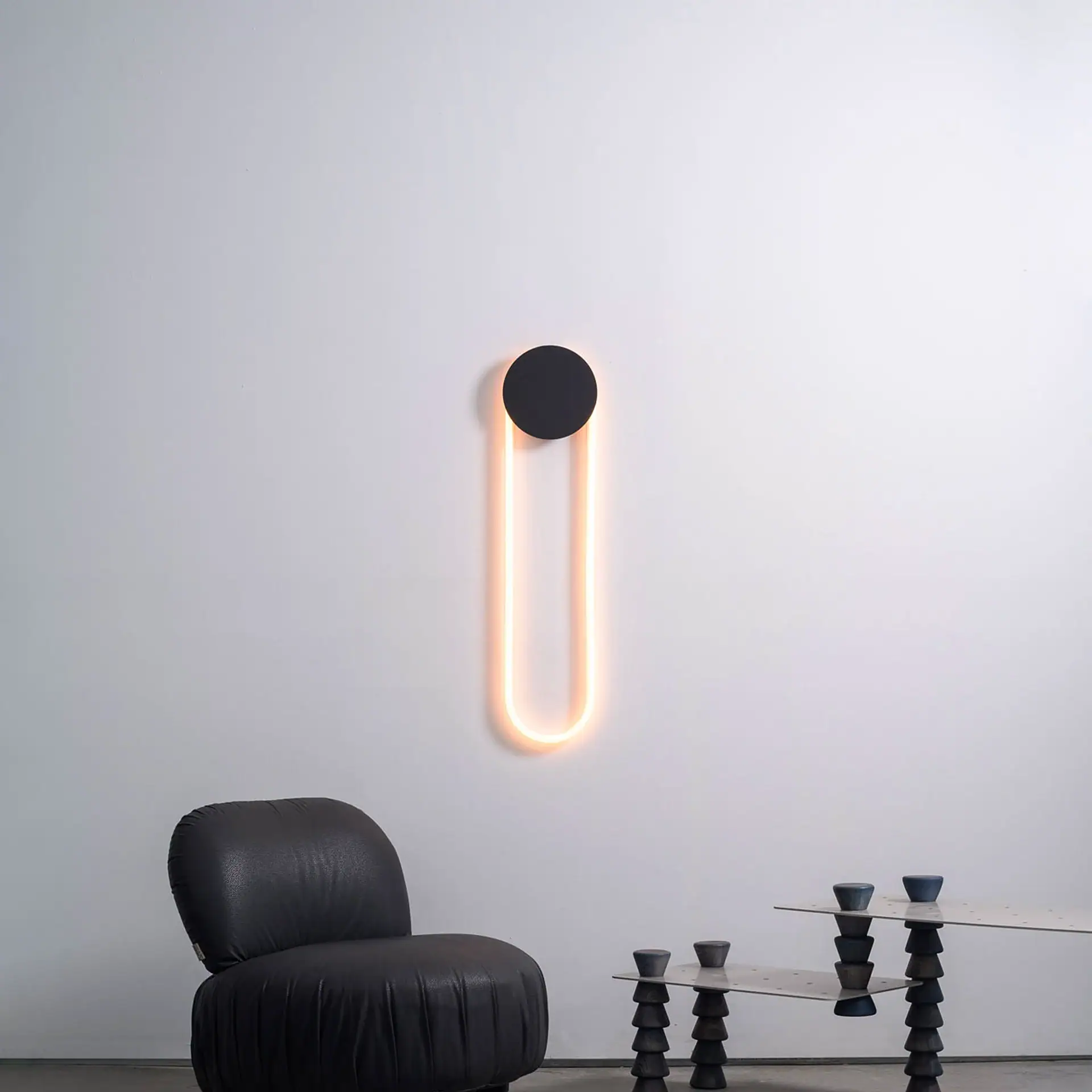 Sklar Furnishings RA Sculptural Wall Sconce on a white wall.