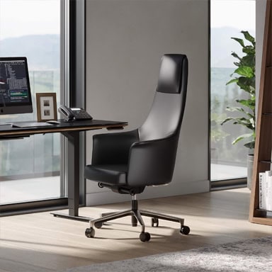 Ergonomic black office chair with high back for professional workspace.