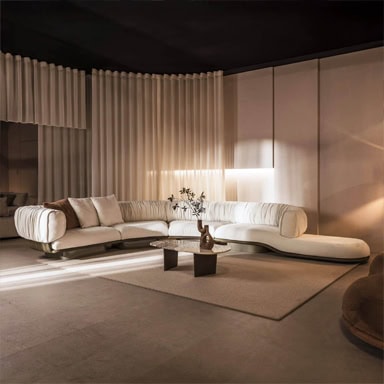 Stylish modern white sectional sofa in a contemporary living room setting.