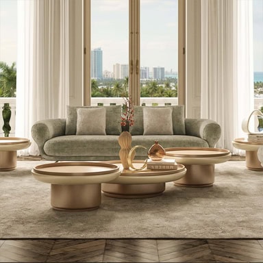Elegant living room featuring marquee-style sofa and coffee tables with city view.