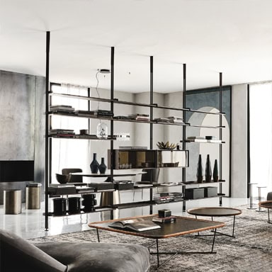 Modern industrial living room with open shelving and minimalist decor.