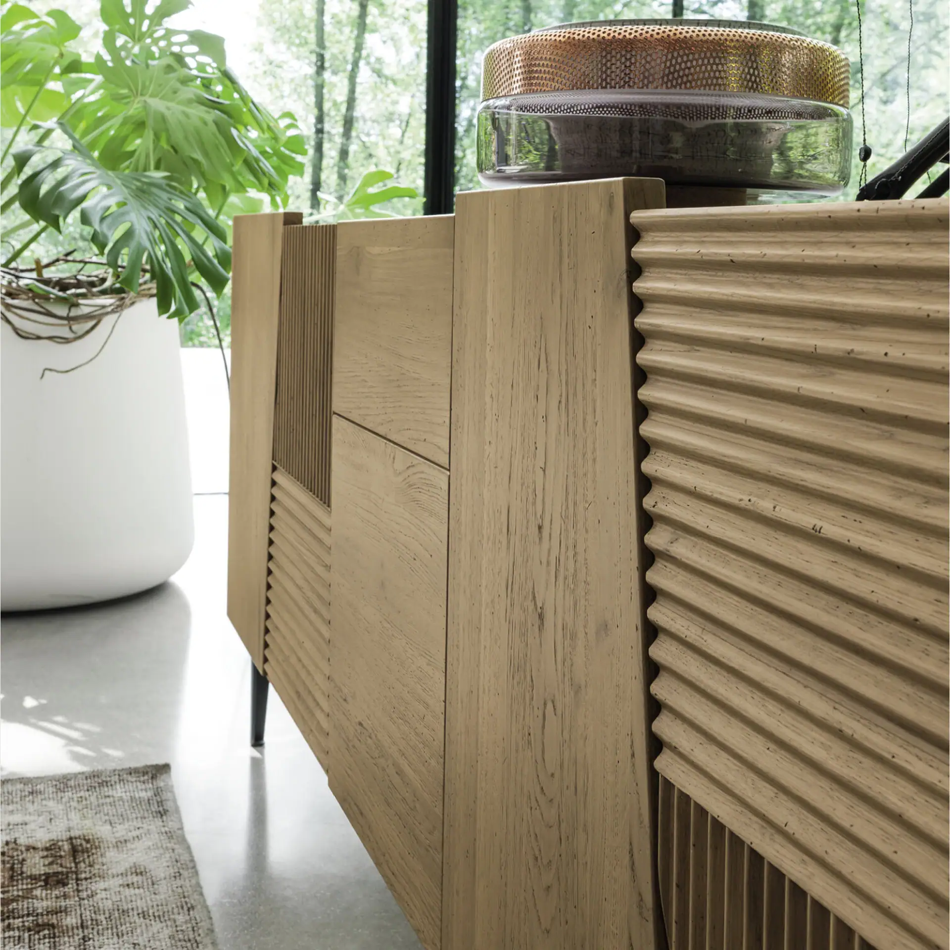 Modern wooden sideboard with textured and smooth finishes for stylish storage.
