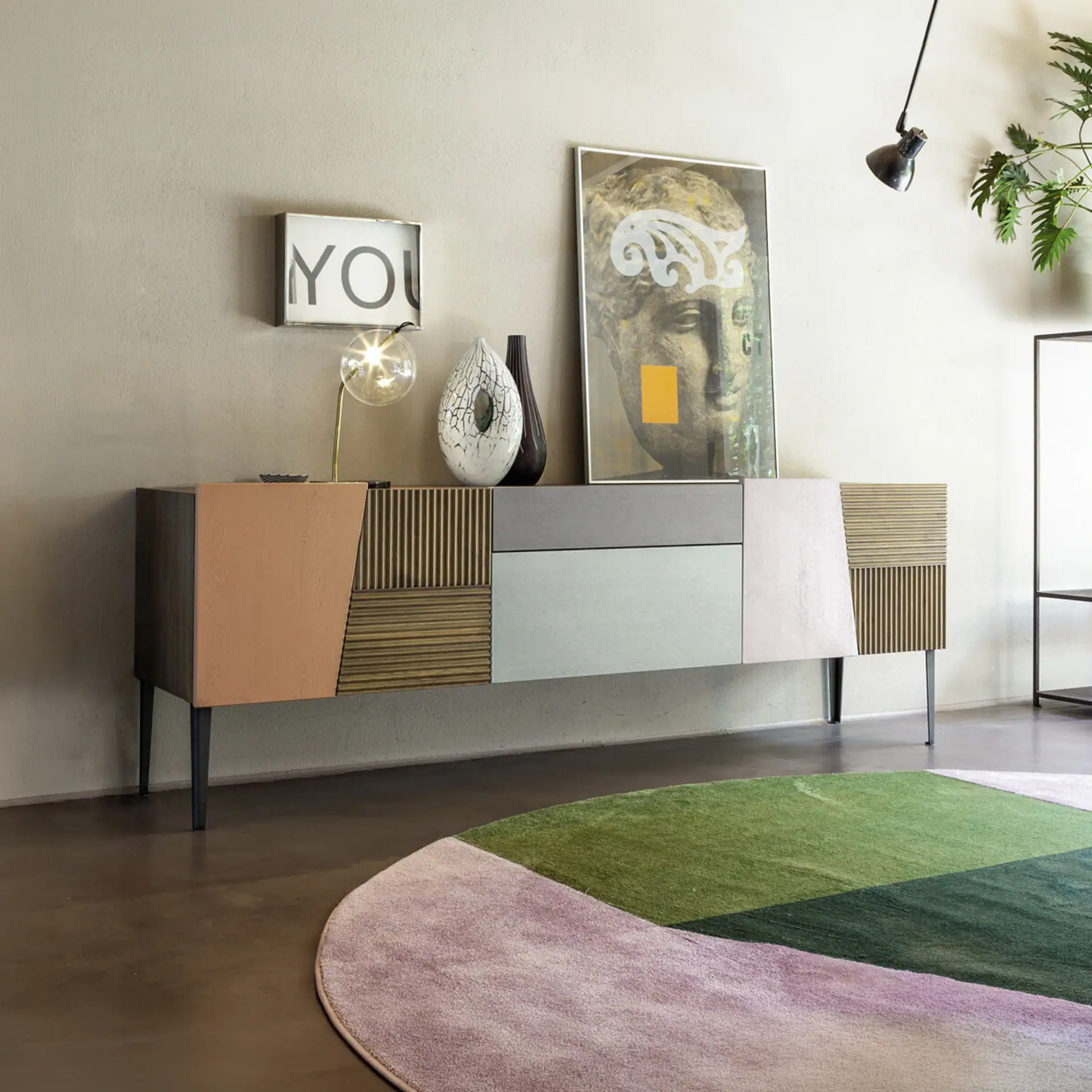 Modern sideboard with mixed wood finishes and sleek design, ideal for contemporary living spaces.