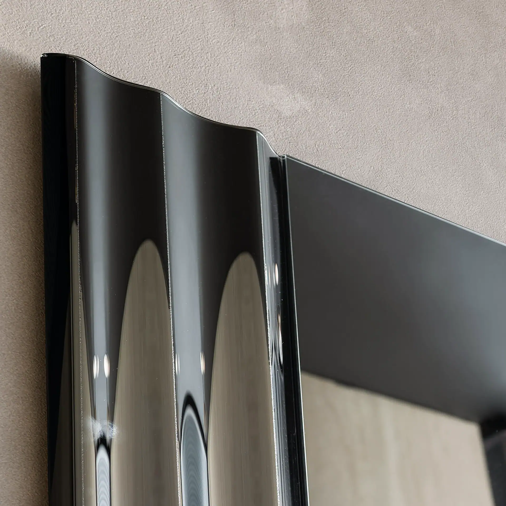 Sklar Furnishings Rolli Vertical Mirror with black frame and reflective surface.