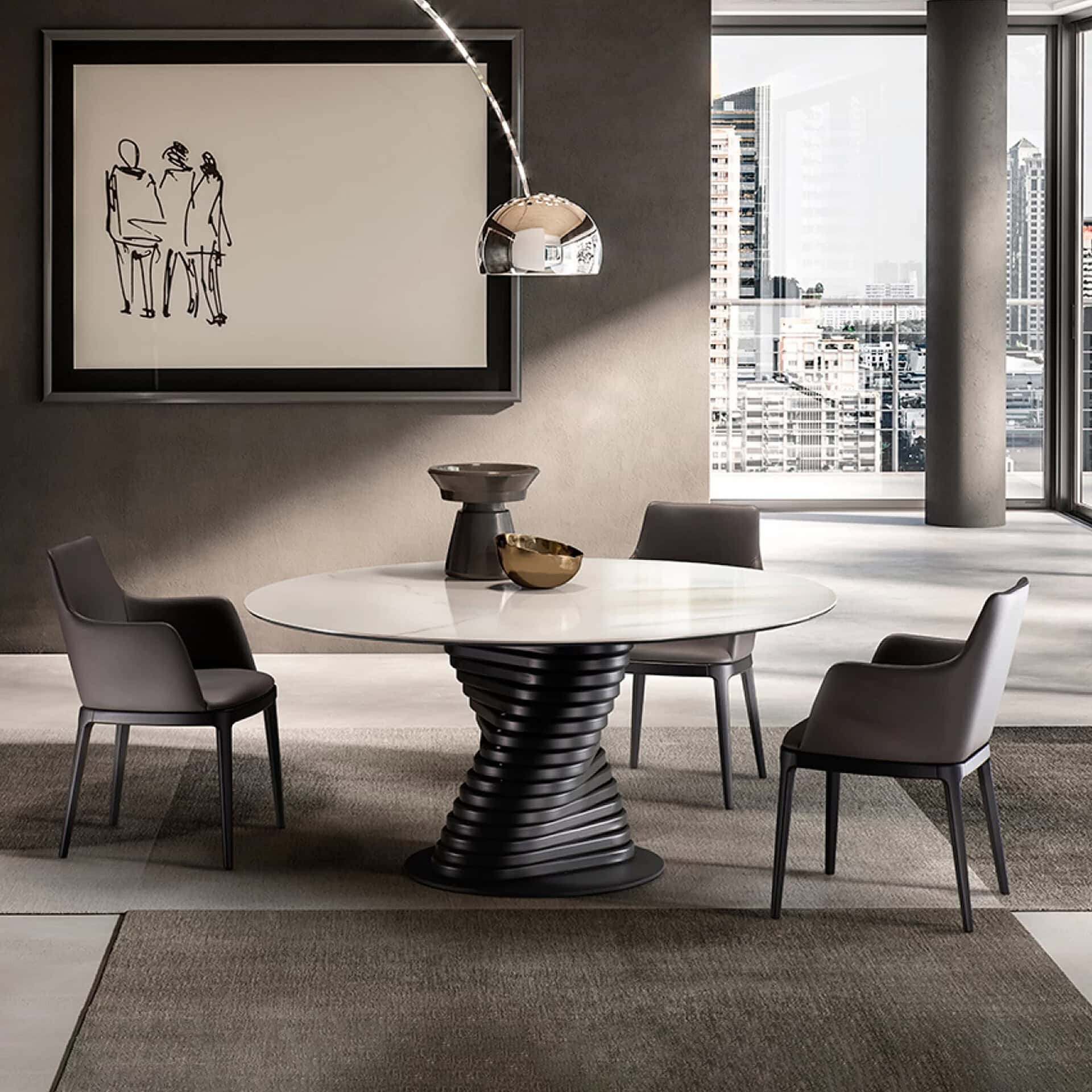 Elegant round dining table with black spiral base and four gray chairs in a sleek, modern setting.