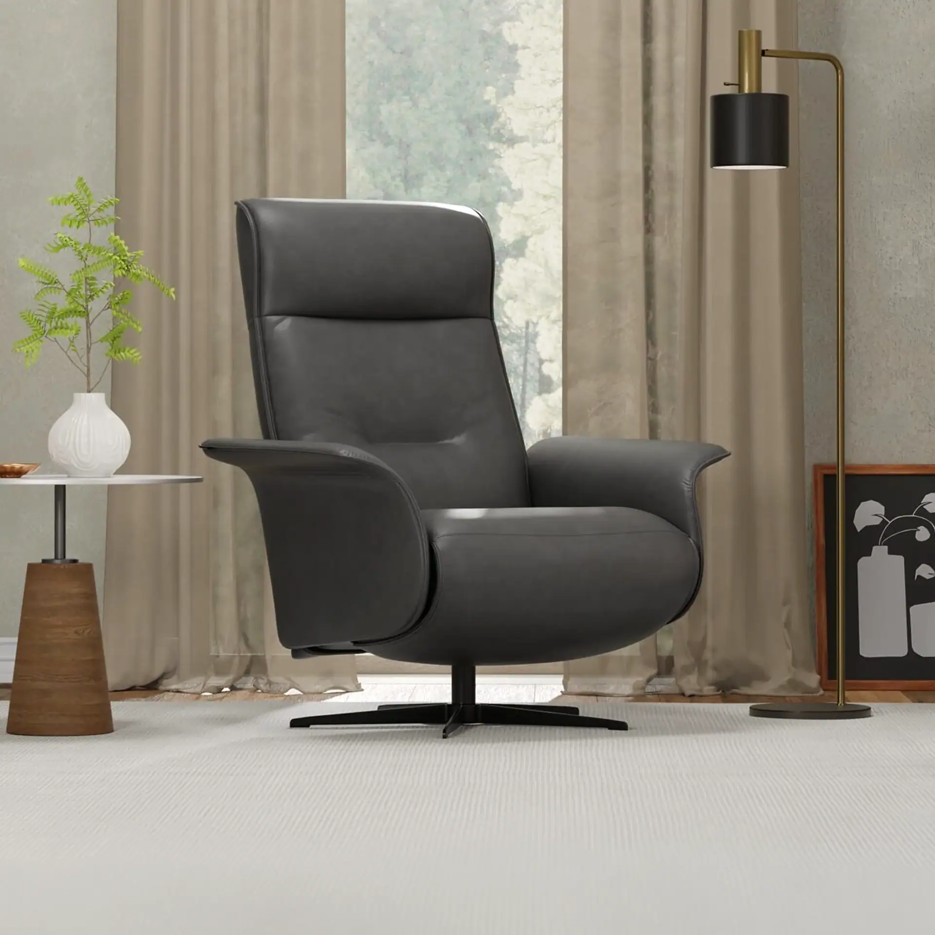 A dark gray leather recliner chair in a modern living room, with a plant on a side table, sheer curtains, and a floor lamp.