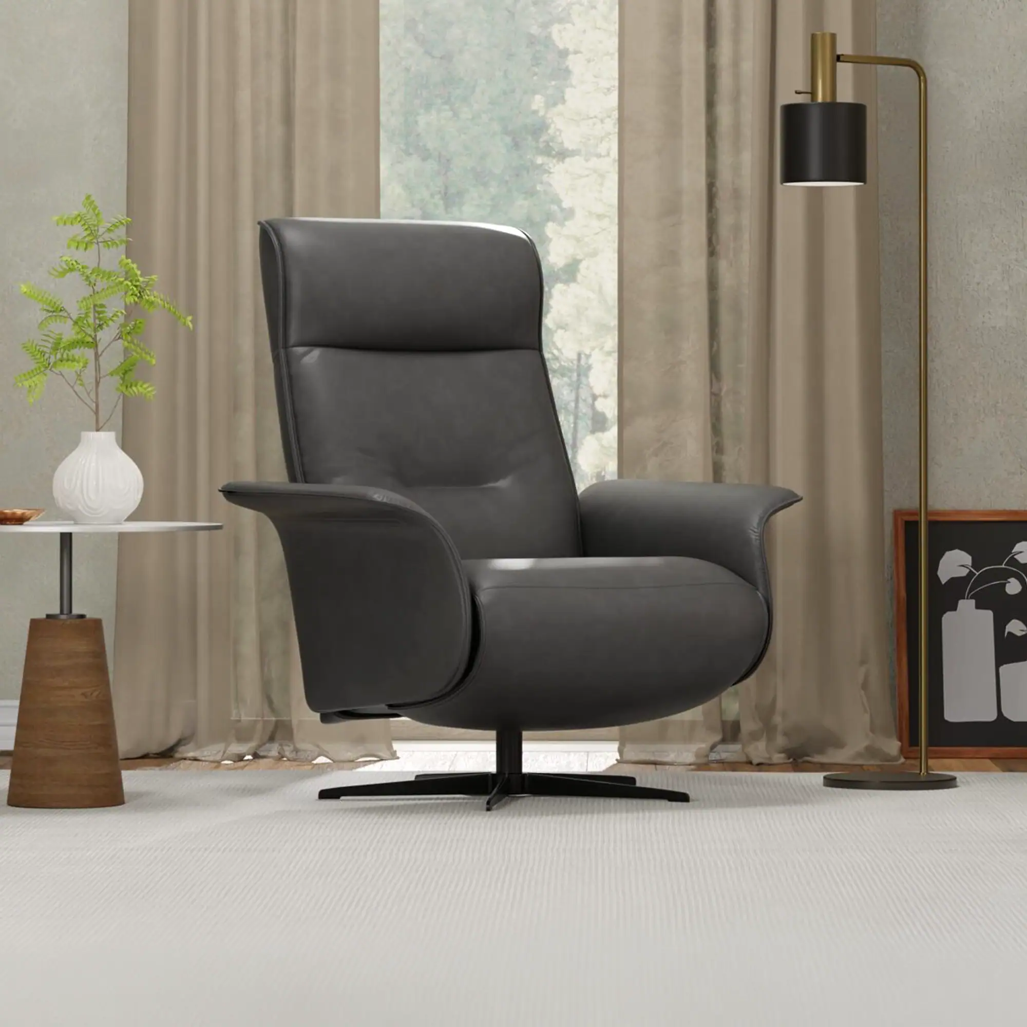 A dark gray leather recliner chair in a modern living room, with a plant on a side table, sheer curtains, and a floor lamp.