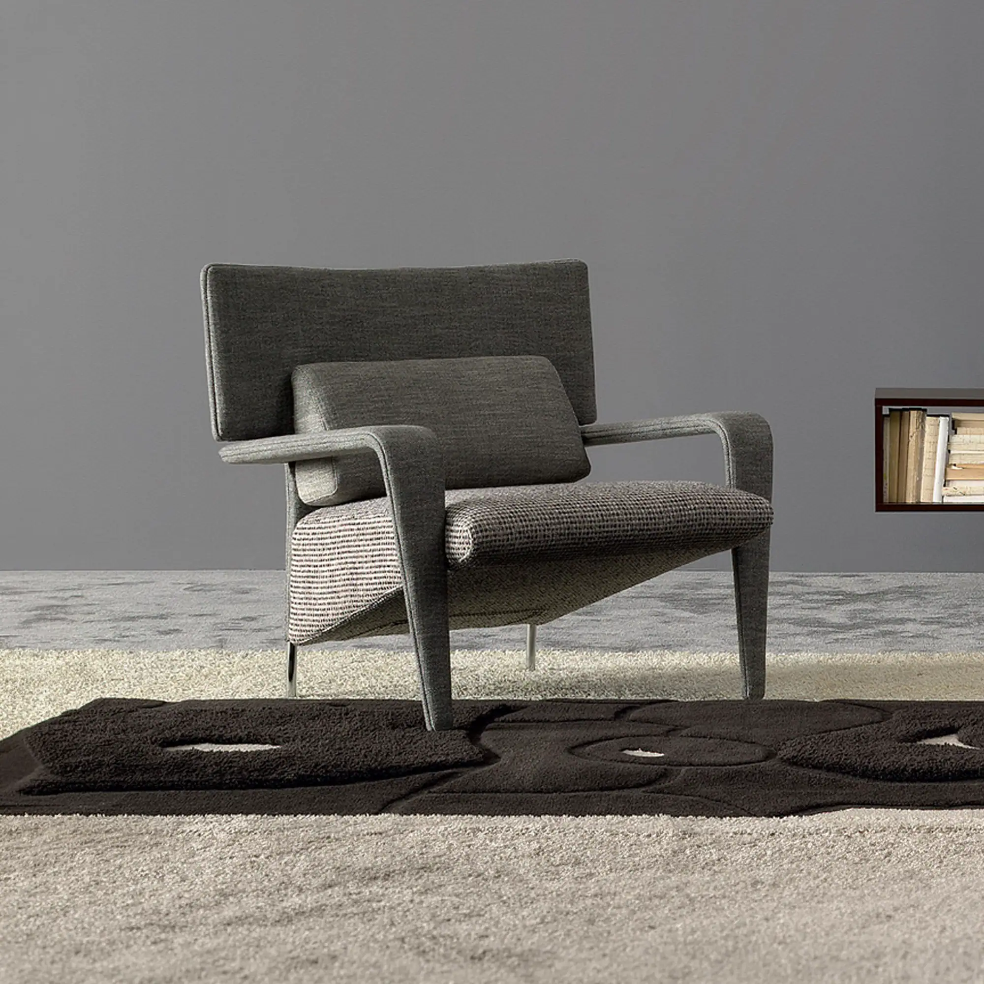 Contemporary upholstered armchair with sleek design and comfortable cushioning.