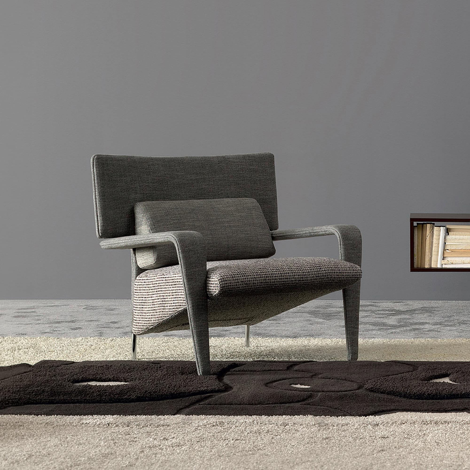 Contemporary upholstered armchair with sleek design and comfortable cushioning.