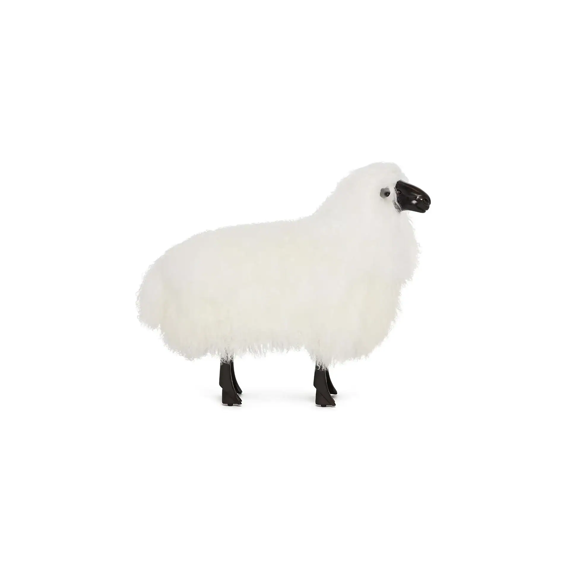 A white sheep figurine with a black head and legs, standing on a white background.