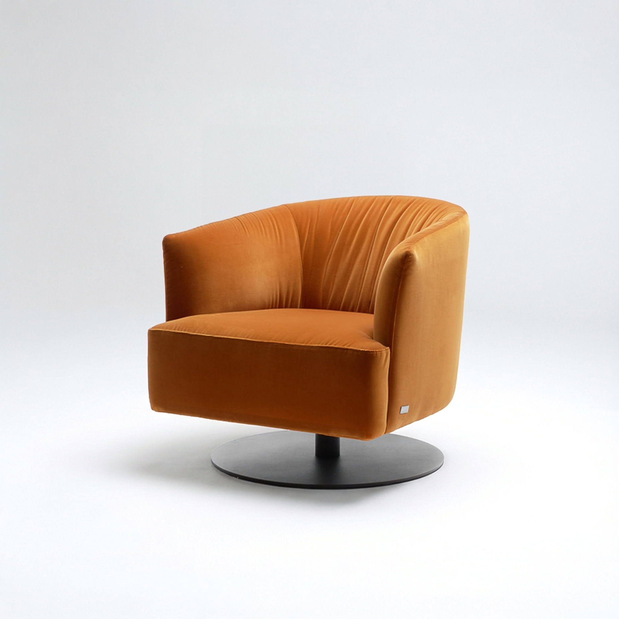 Orange lounge chair with a sleek, contemporary design and rounded backrest.