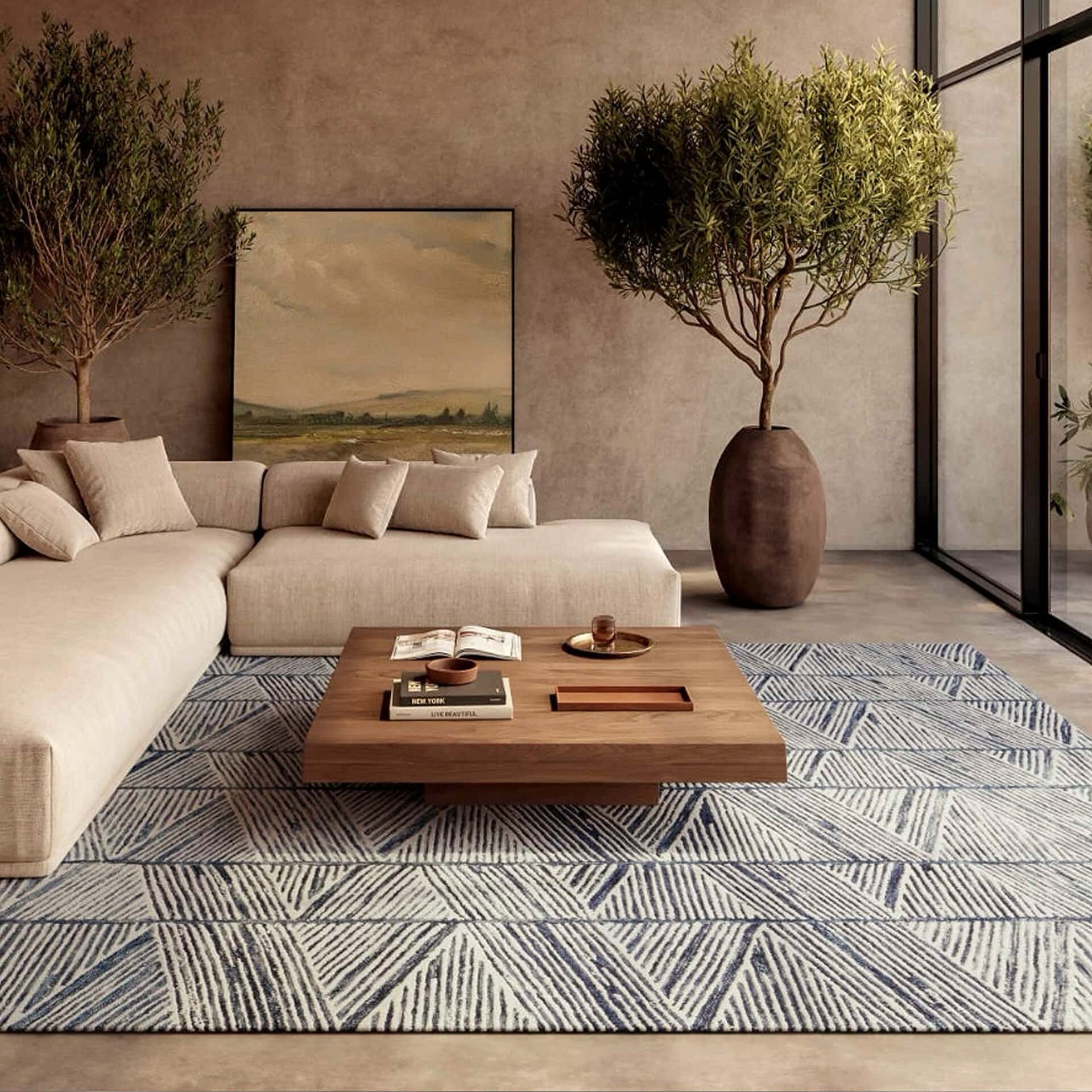 Elegant living room with beige sofa, large potted trees, and a stylish coffee table.