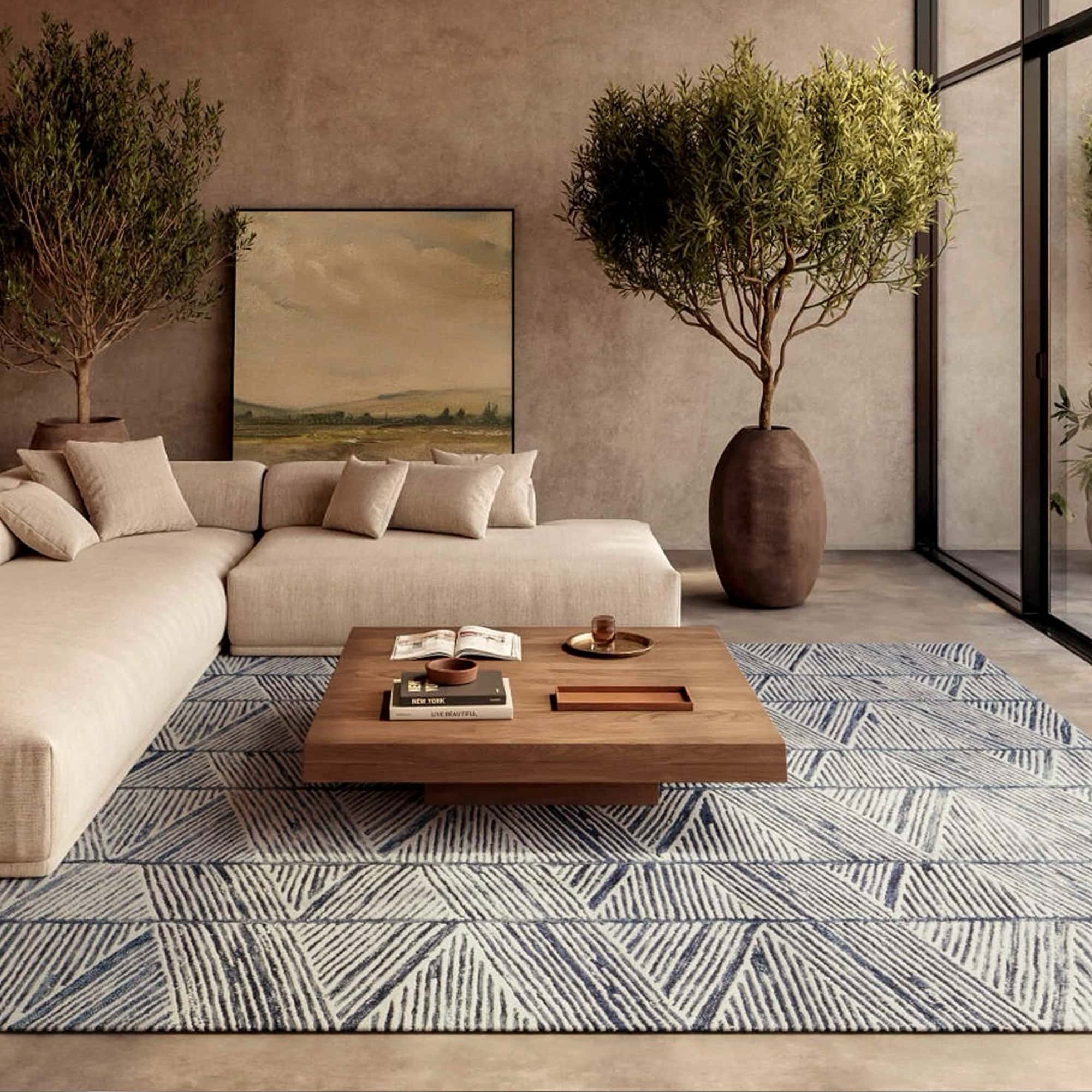 Elegant living room with beige sofa, large potted trees, and a stylish coffee table.