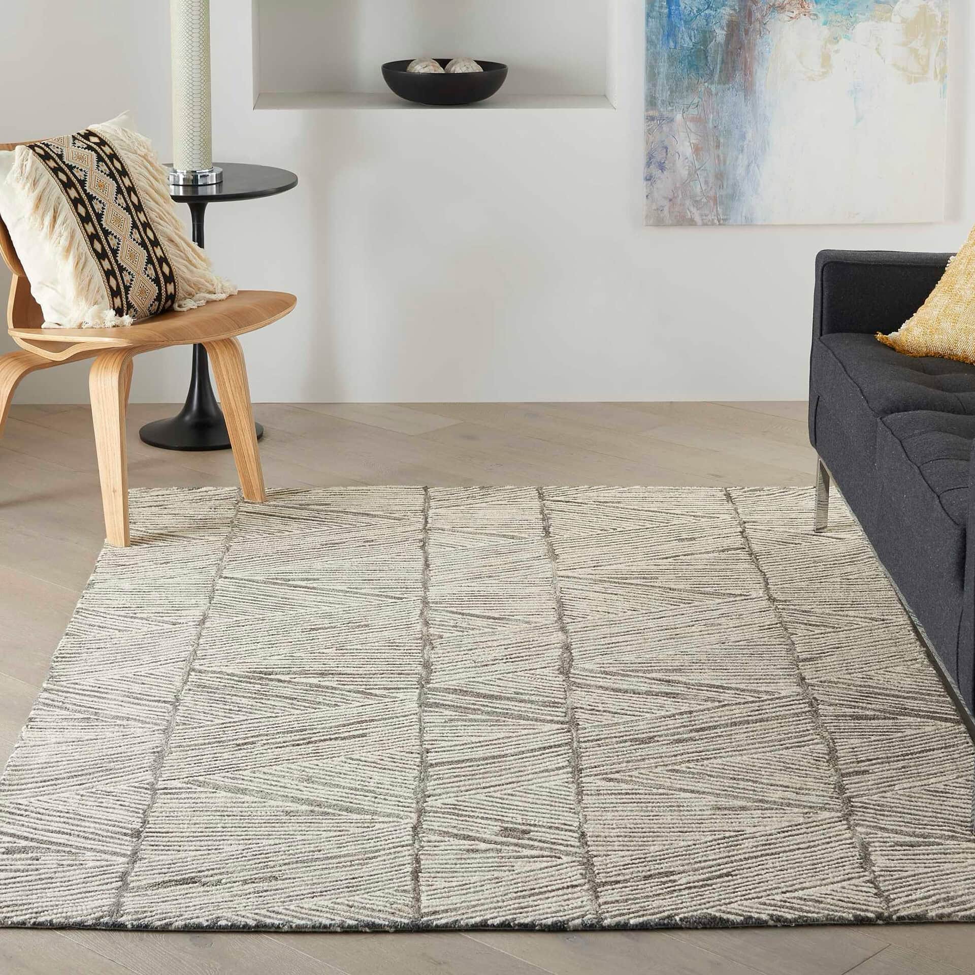 Stylish beige and gray textured rug with contemporary design.