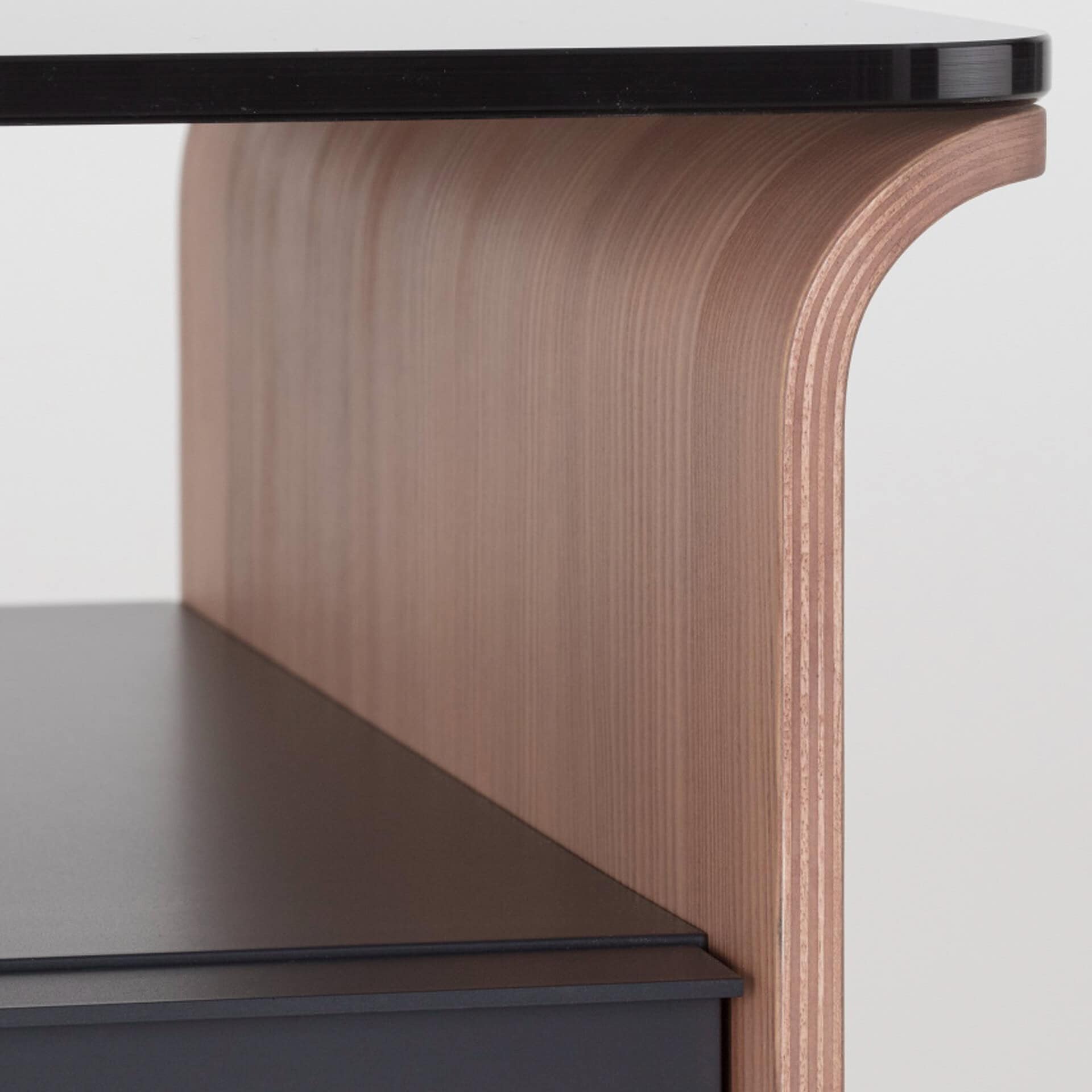 Elegant glass top nightstand with wooden base, perfect for contemporary bedroom decor.