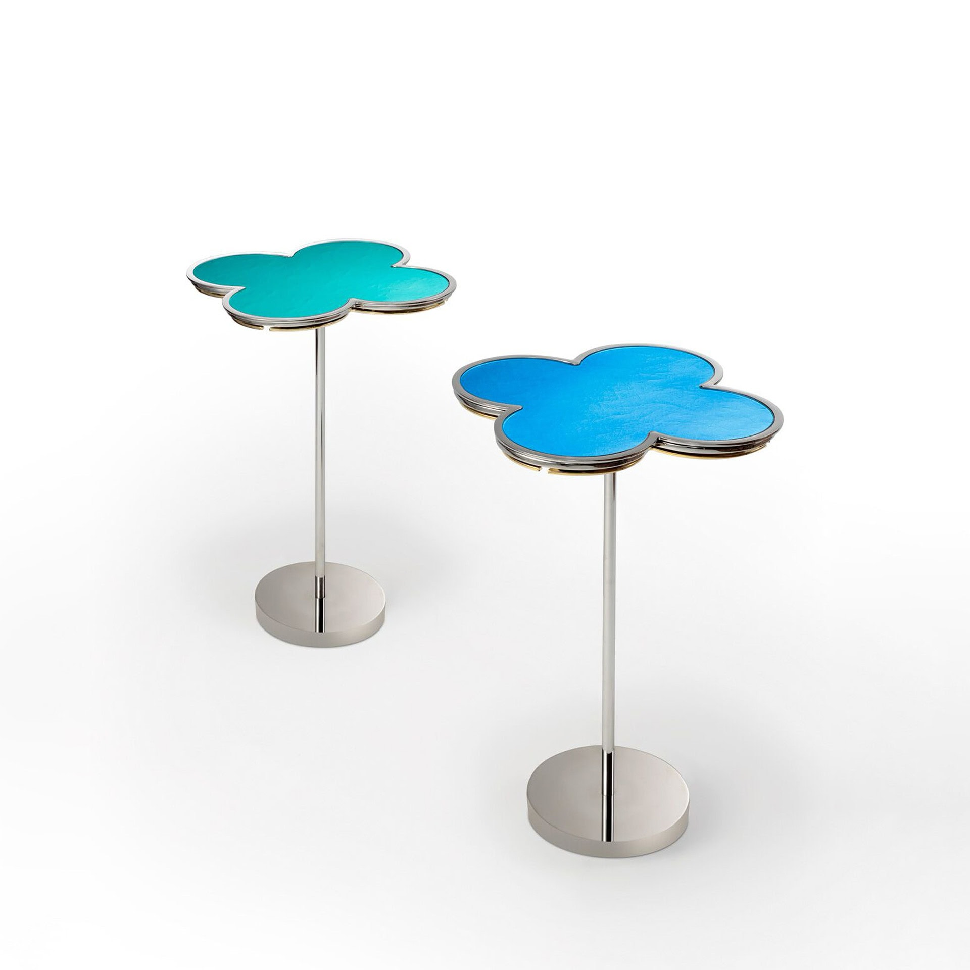 Contemporary cloud-shaped side tables with vibrant blue and teal tops and metal stands.