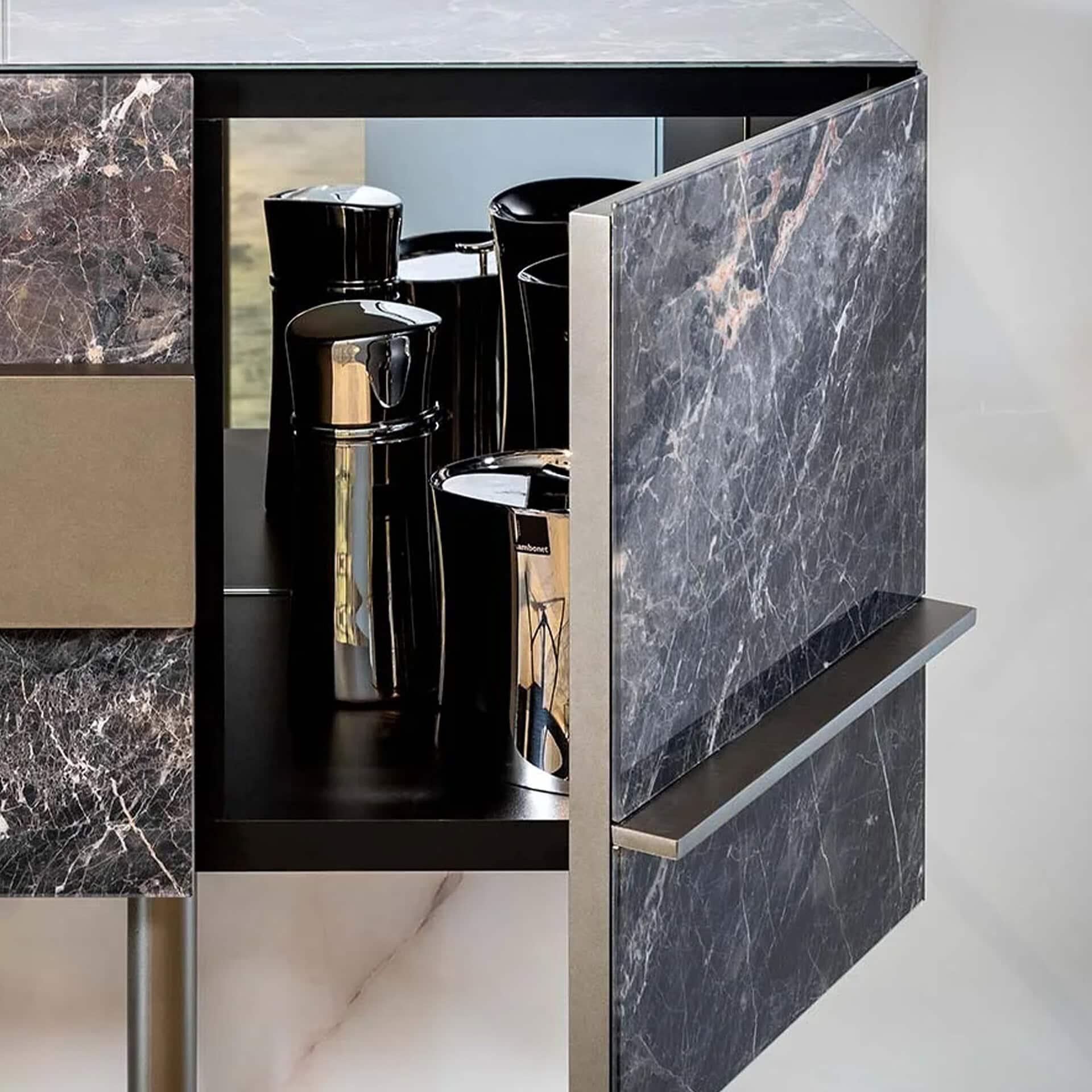 Elegant marble bar cart with black and gold accents for stylish home bar setups.