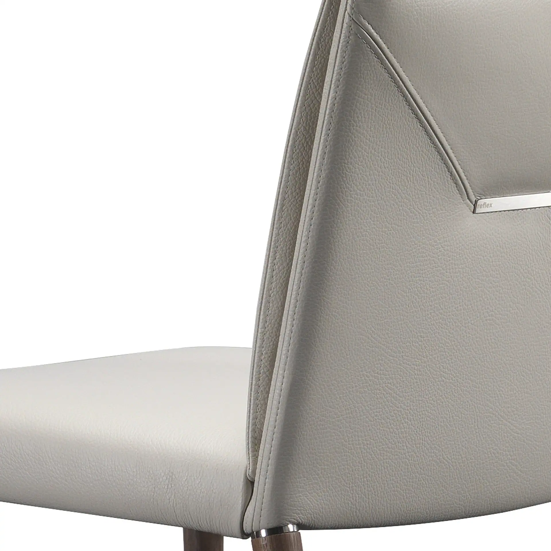 Sklar Furnishings modern chair with sleek design and light grey upholstery.