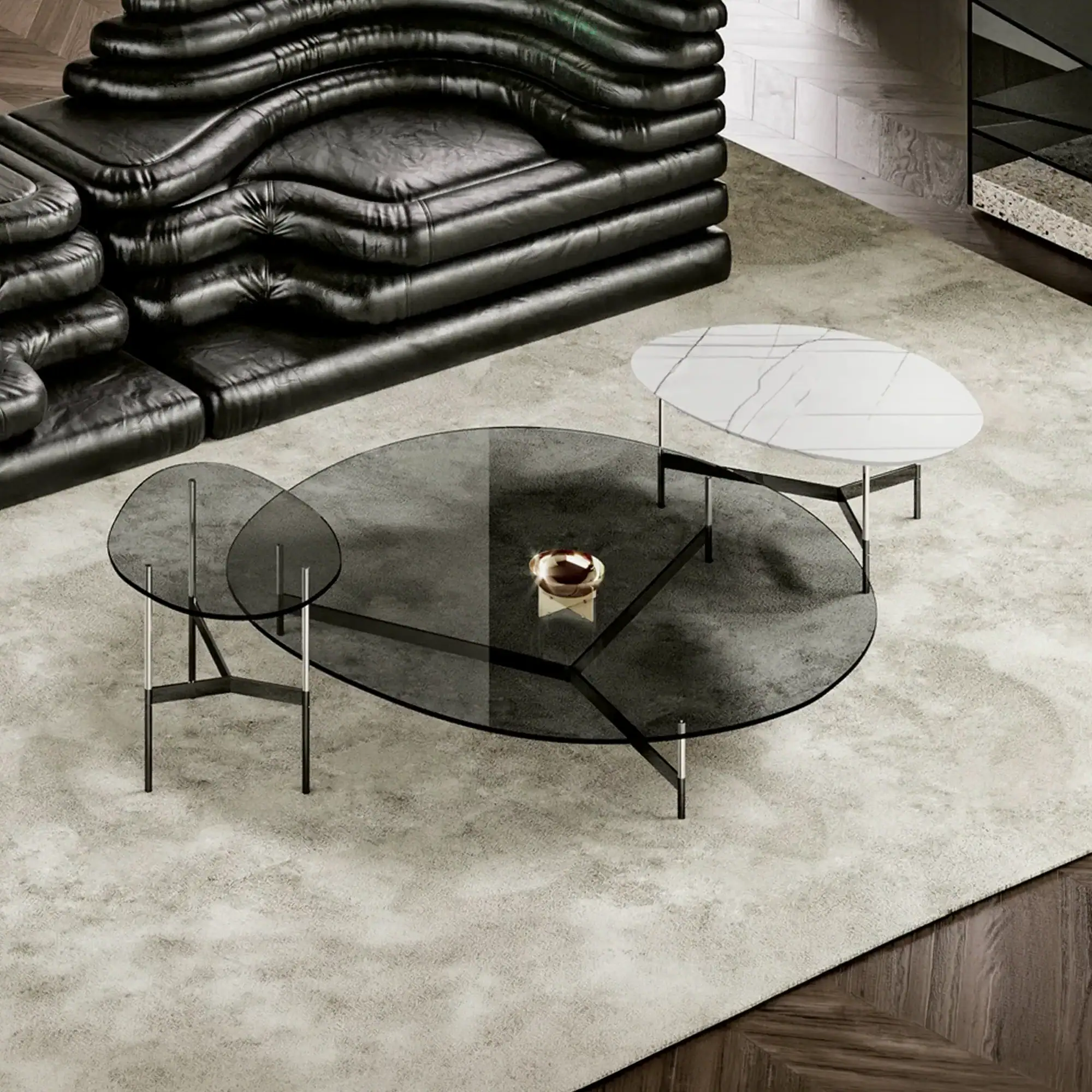 Set of three Sklar Furnishings coffee tables with glass tops in living room.