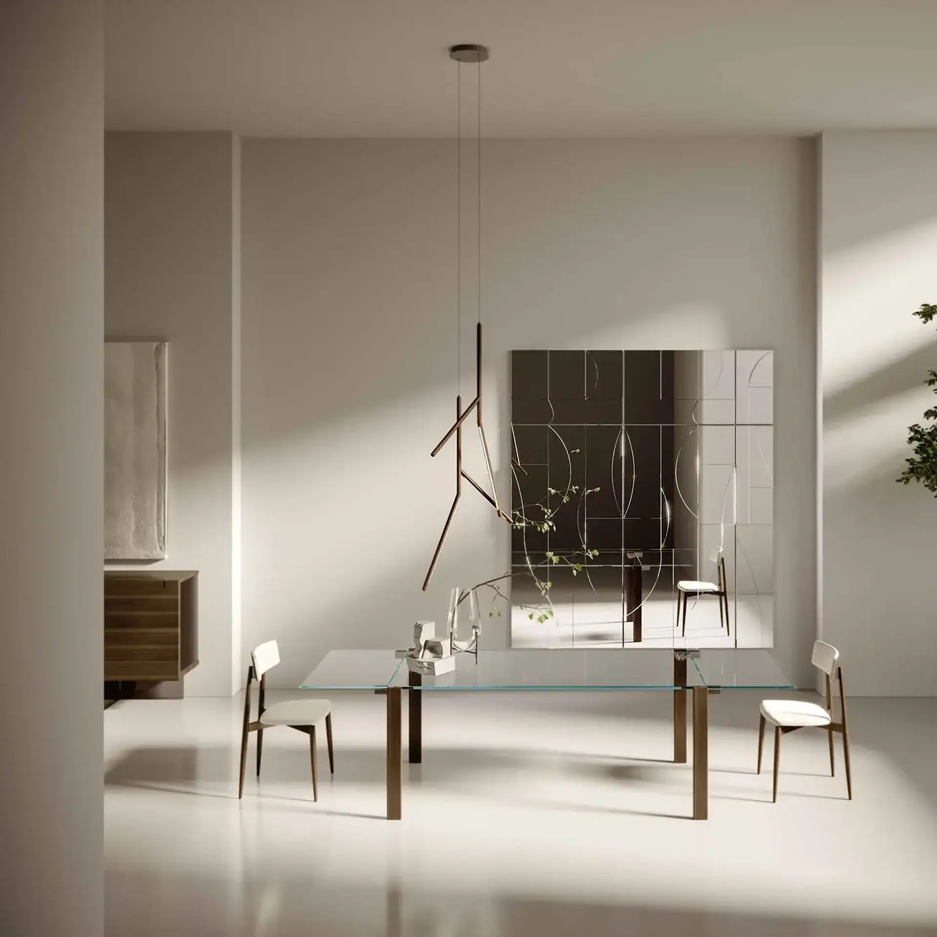 A modern dining room with a glass table, two chairs, an abstract pendant light, and a decorative mirror on the wall.