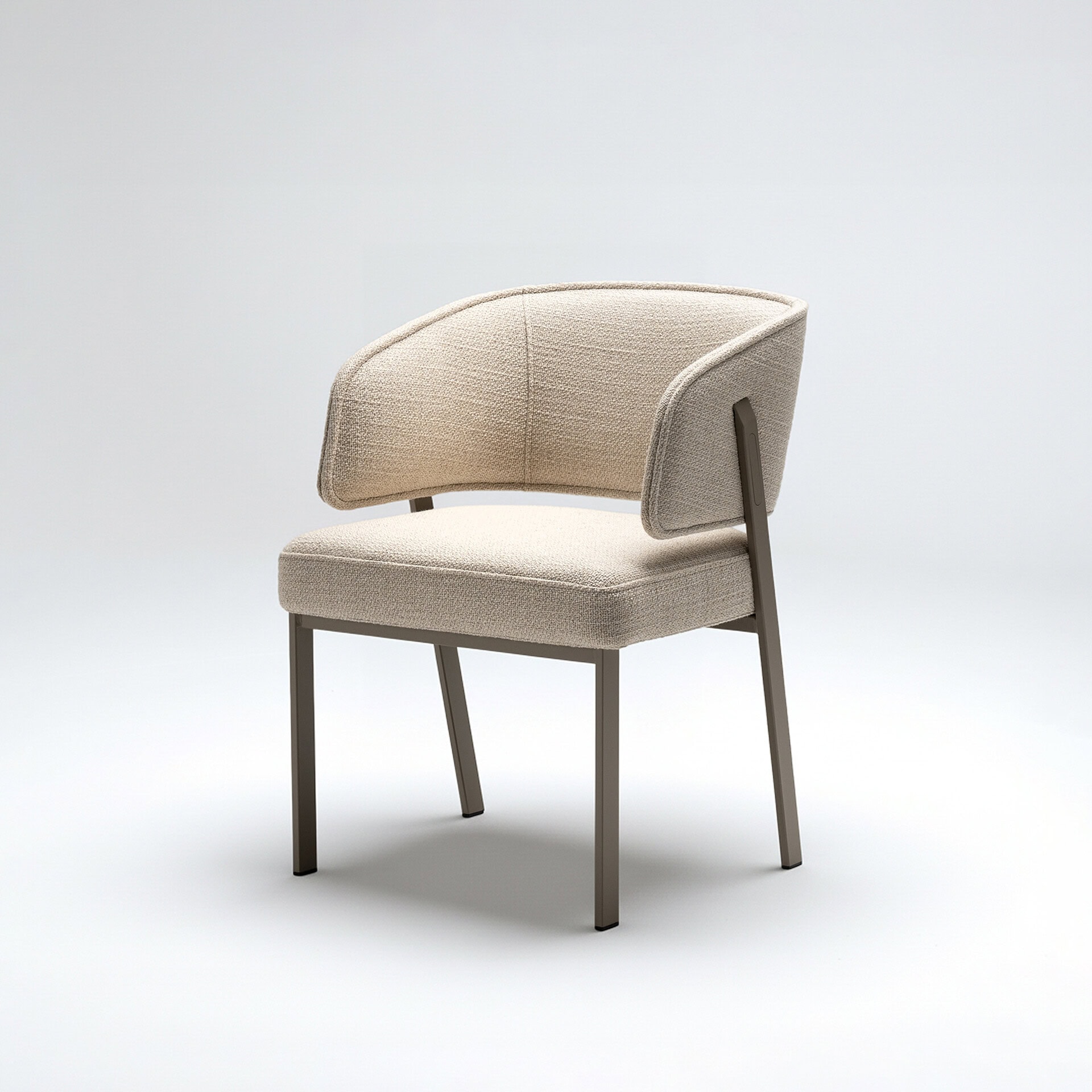 Elegant beige upholstered accent chair with sleek wooden legs.