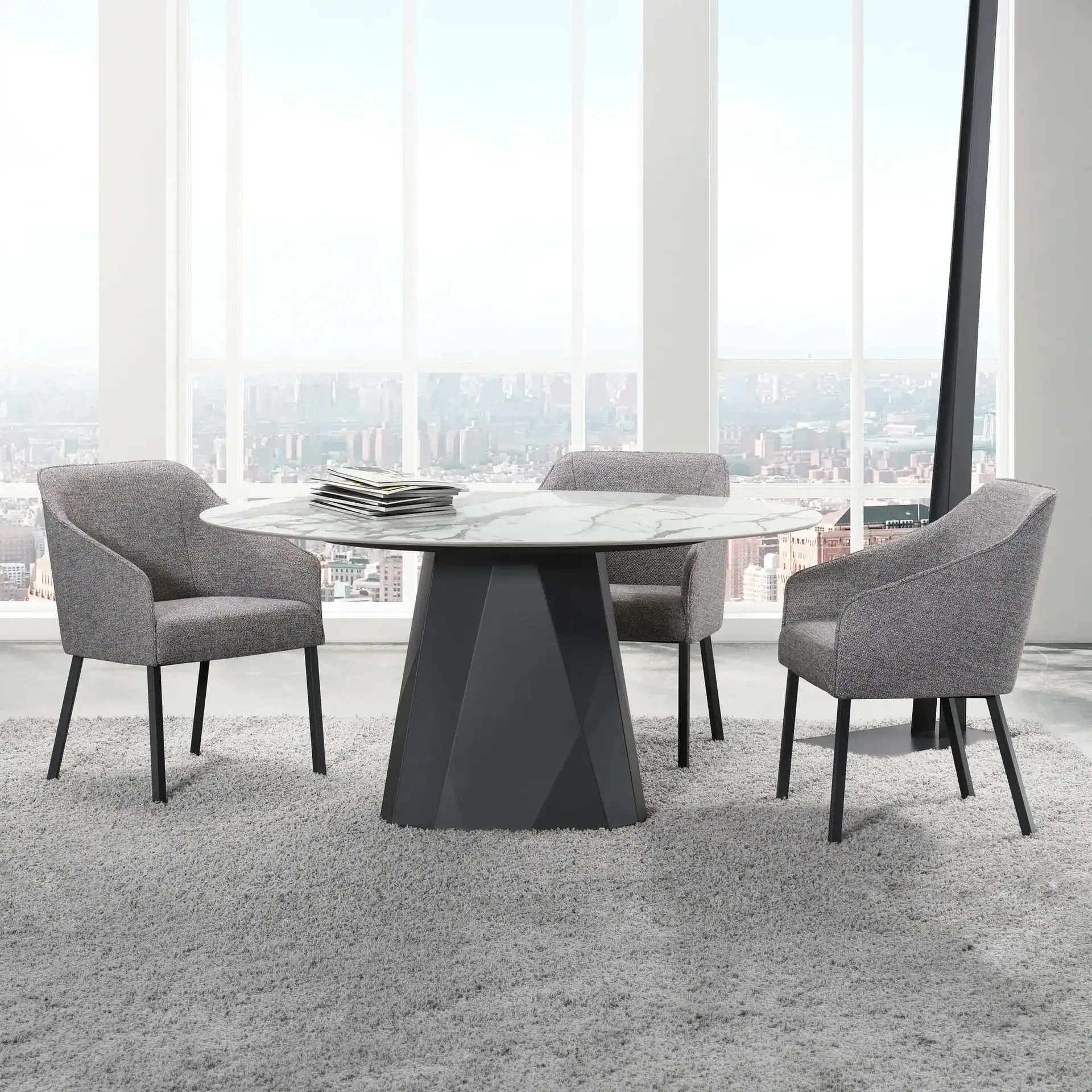 Elegant round dining table with gray upholstered chairs in a sleek, modern office space with city vi.