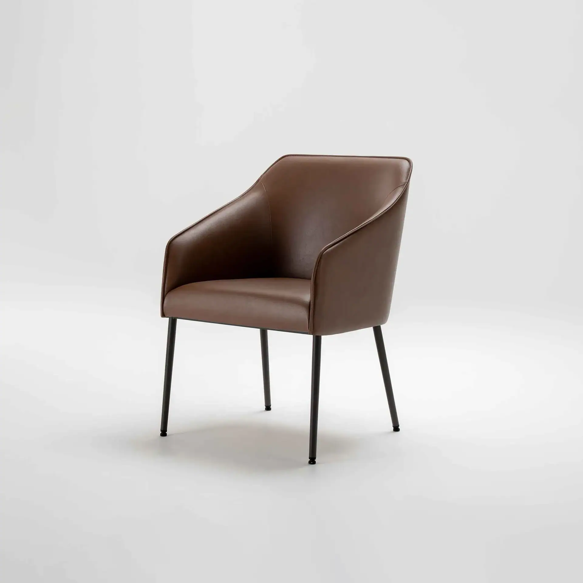 Brown leather armchair with sleek black metal legs, ideal for office or lounge settings.
