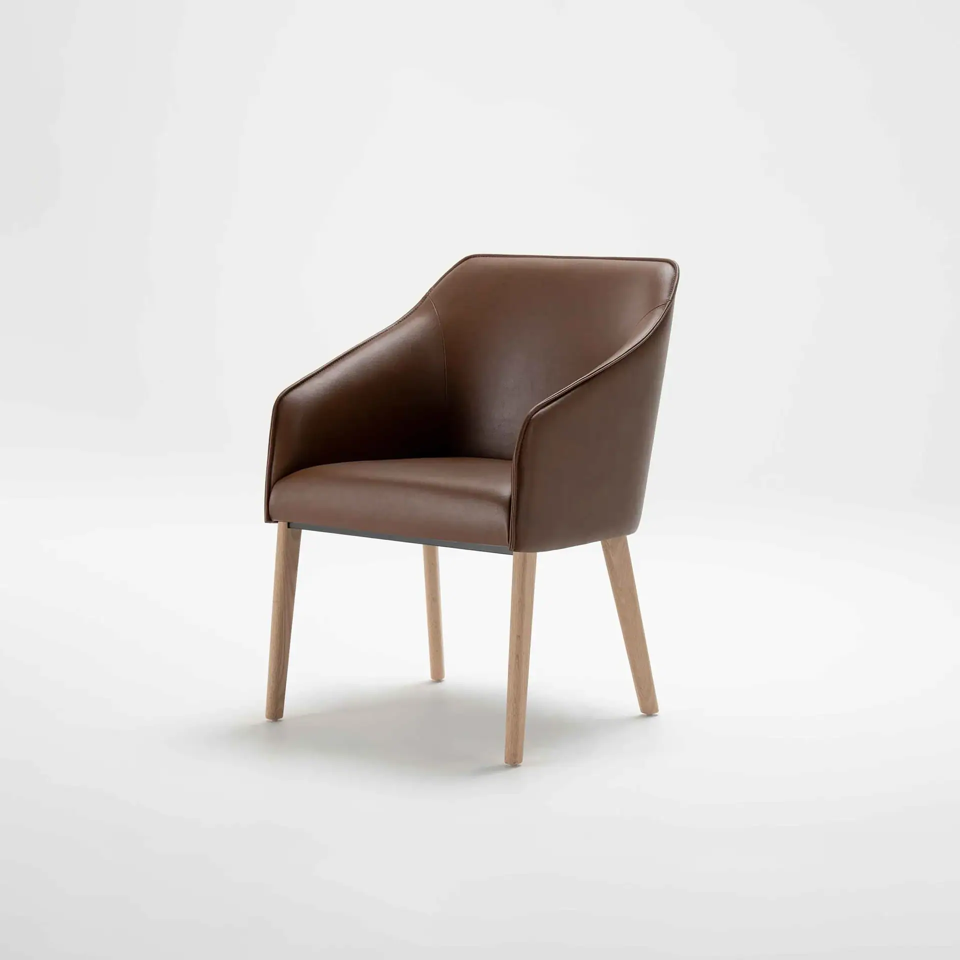 Stylish brown leather armchair with wooden legs, perfect for contemporary living spaces.