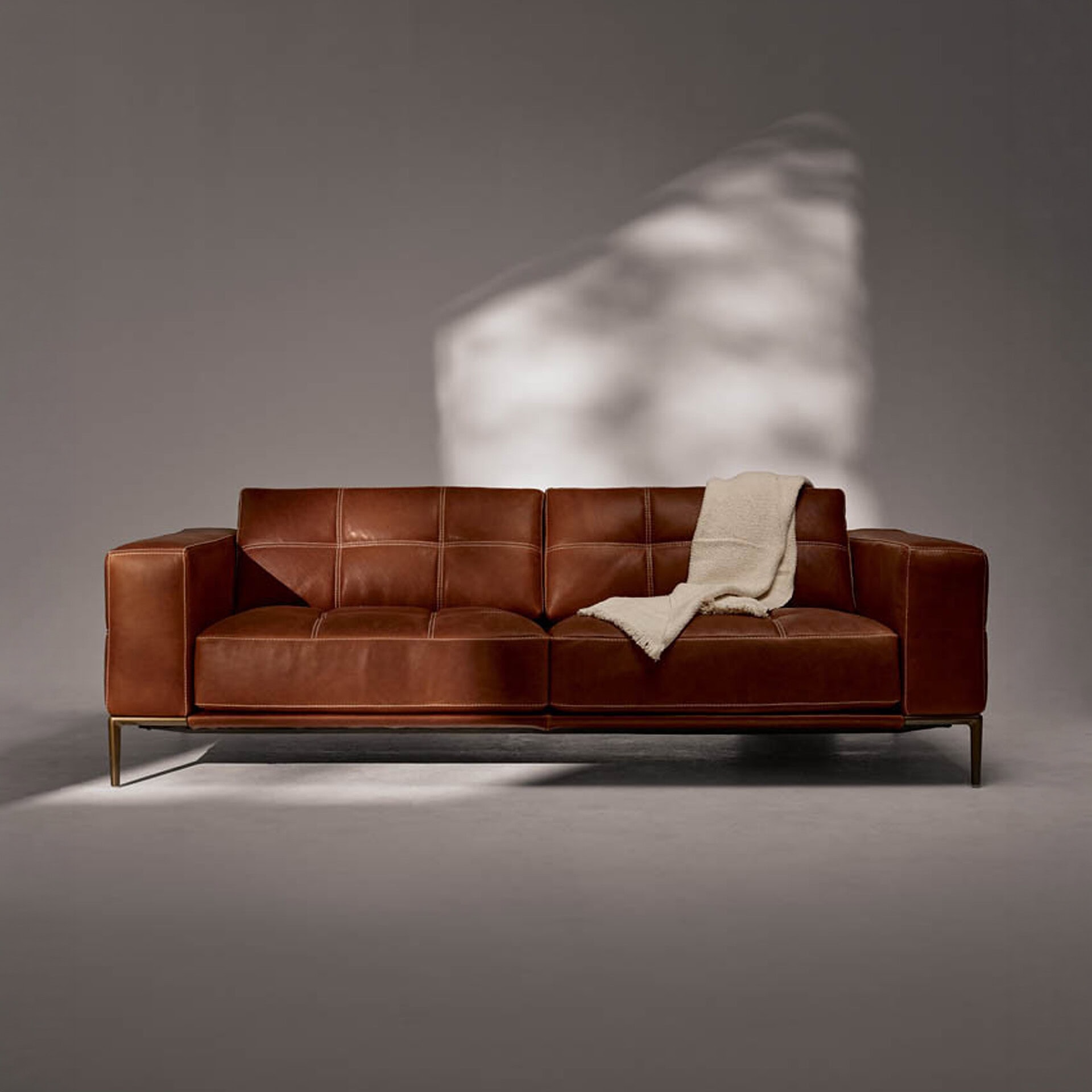 Elegant leather Barcelona modular sectional sofa with clean lines and plush cushions, perfect for co.