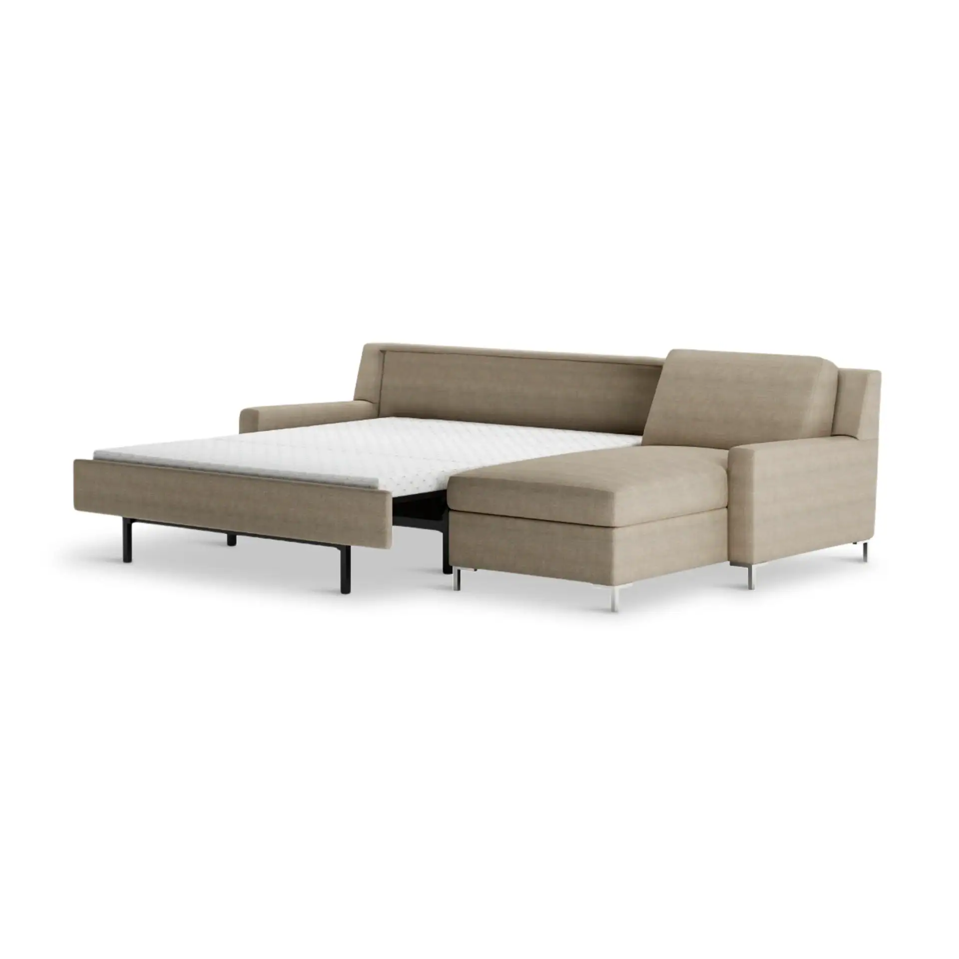 A modern beige sectional sofa with a pull-out bed extended, revealing a white mattress. The sofa has a chaise lounge on the right and slim metal legs.