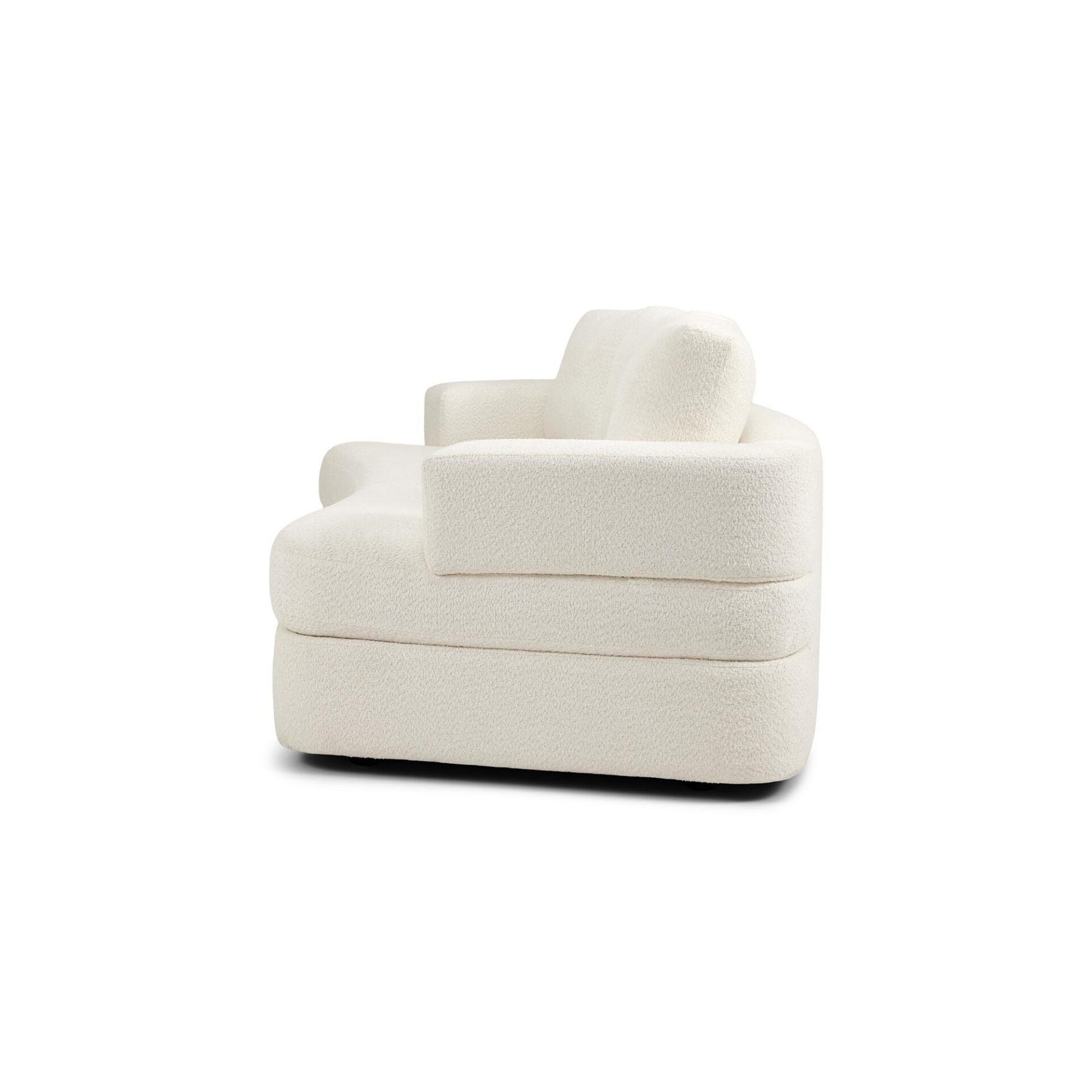 Side view of a cream-colored, textured boucle sofa with rounded edges on a white background.
