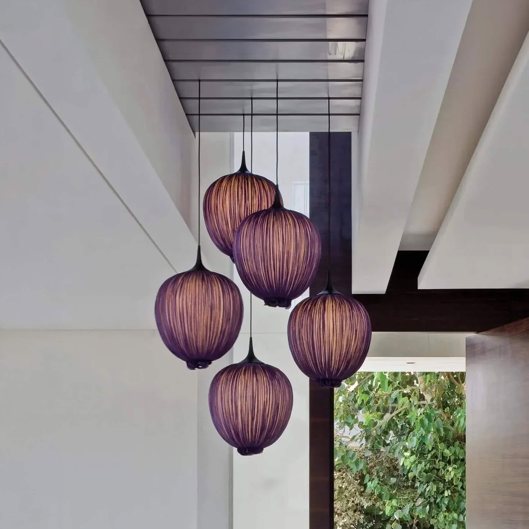 Elegant Dippa Silk Pendant Light with five hanging shades in a modern interior.