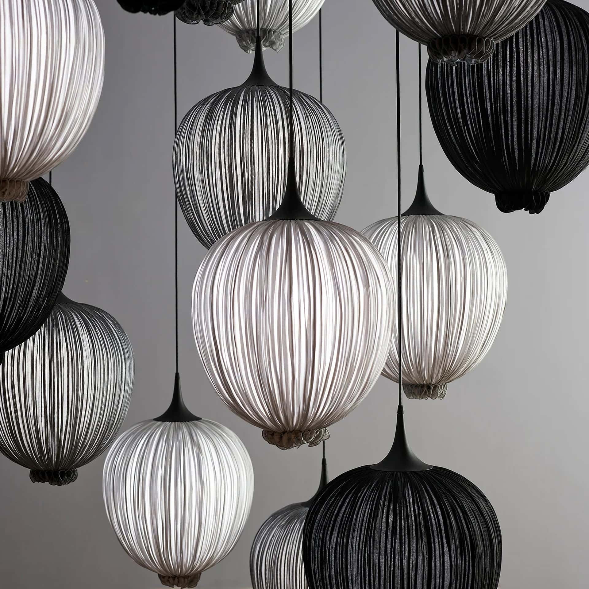 Elegant Dippa Silk Pendant Light with black and white shades.