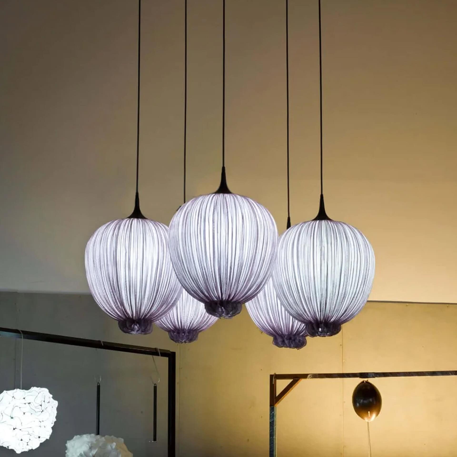 Elegant Dippa Silk Pendant Light with four hanging shades for modern interiors.