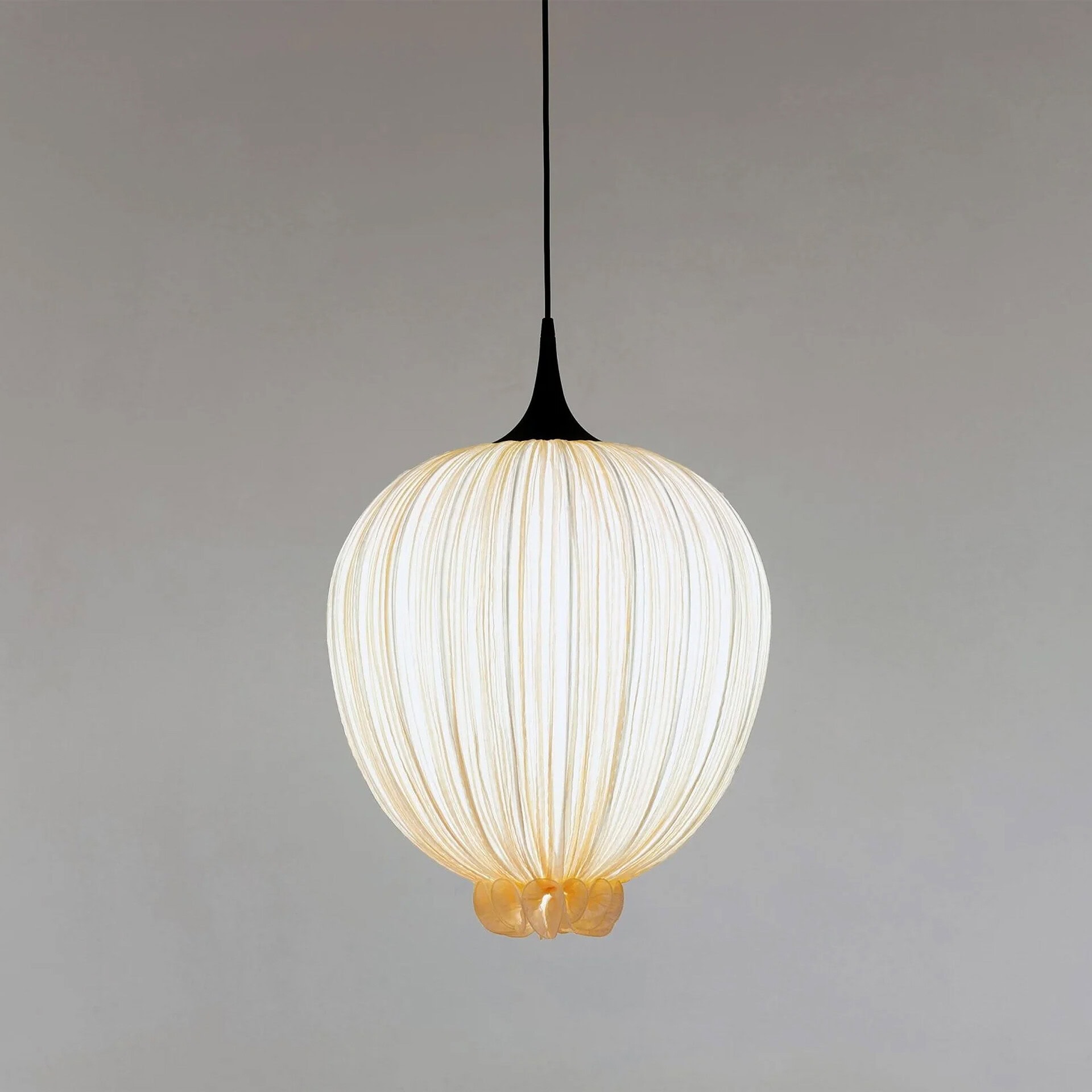 Elegant Dippa Silk Pendant Light with soft glow and textured design.