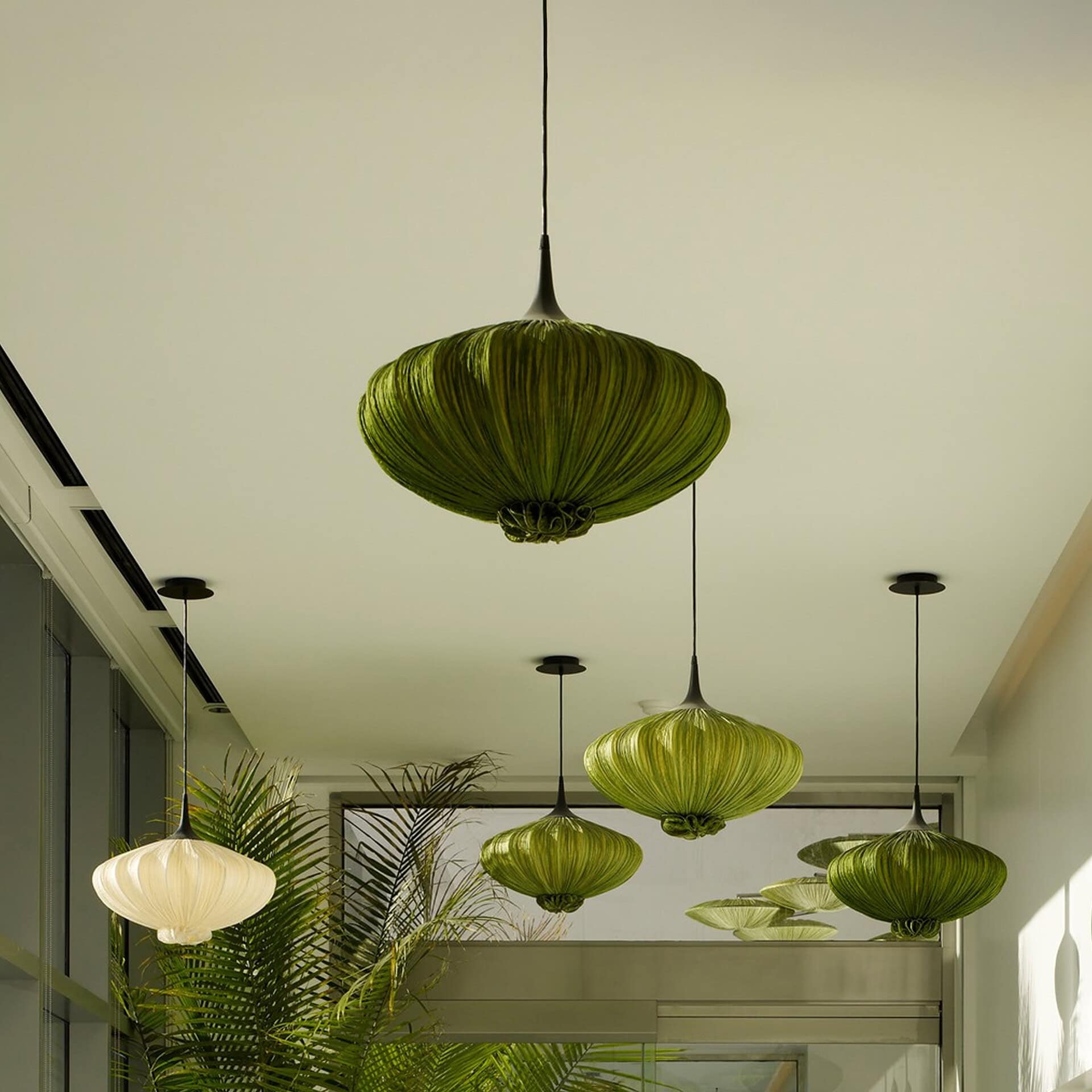 Elegant green silk pendant light for modern interiors.