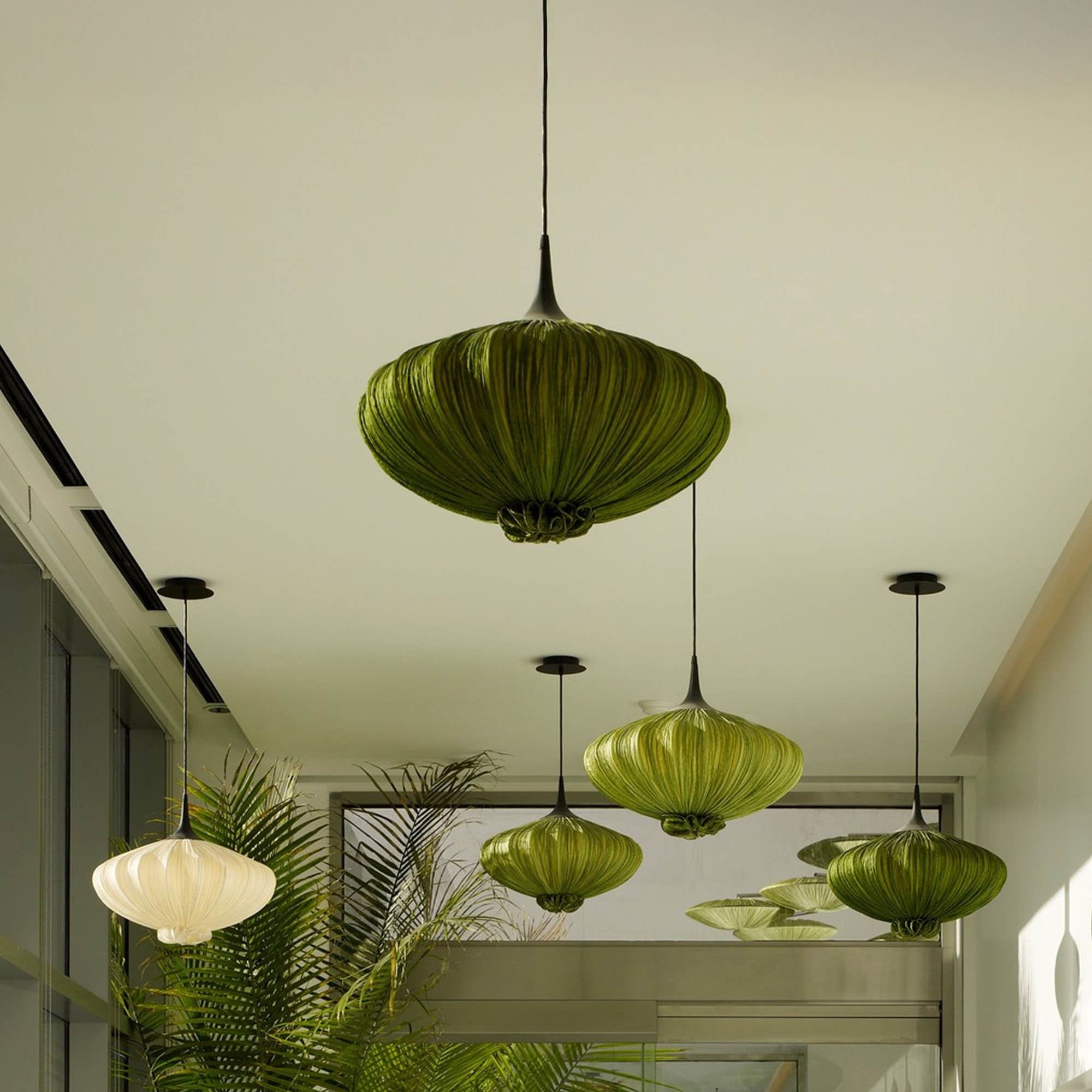 Elegant green silk pendant light for modern interiors.