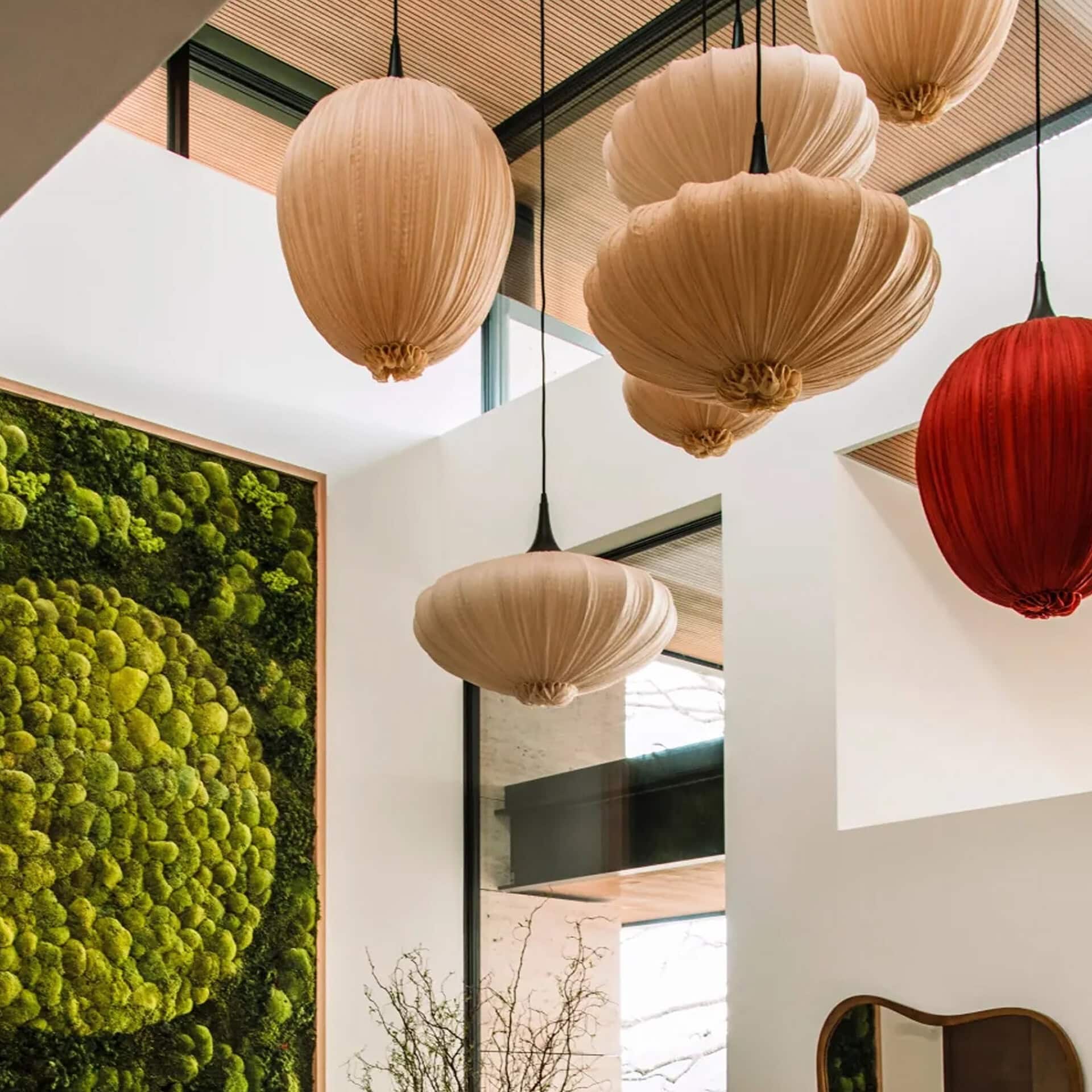 Elegant silk pendant light fixtures in neutral and red tones for modern interior decor.