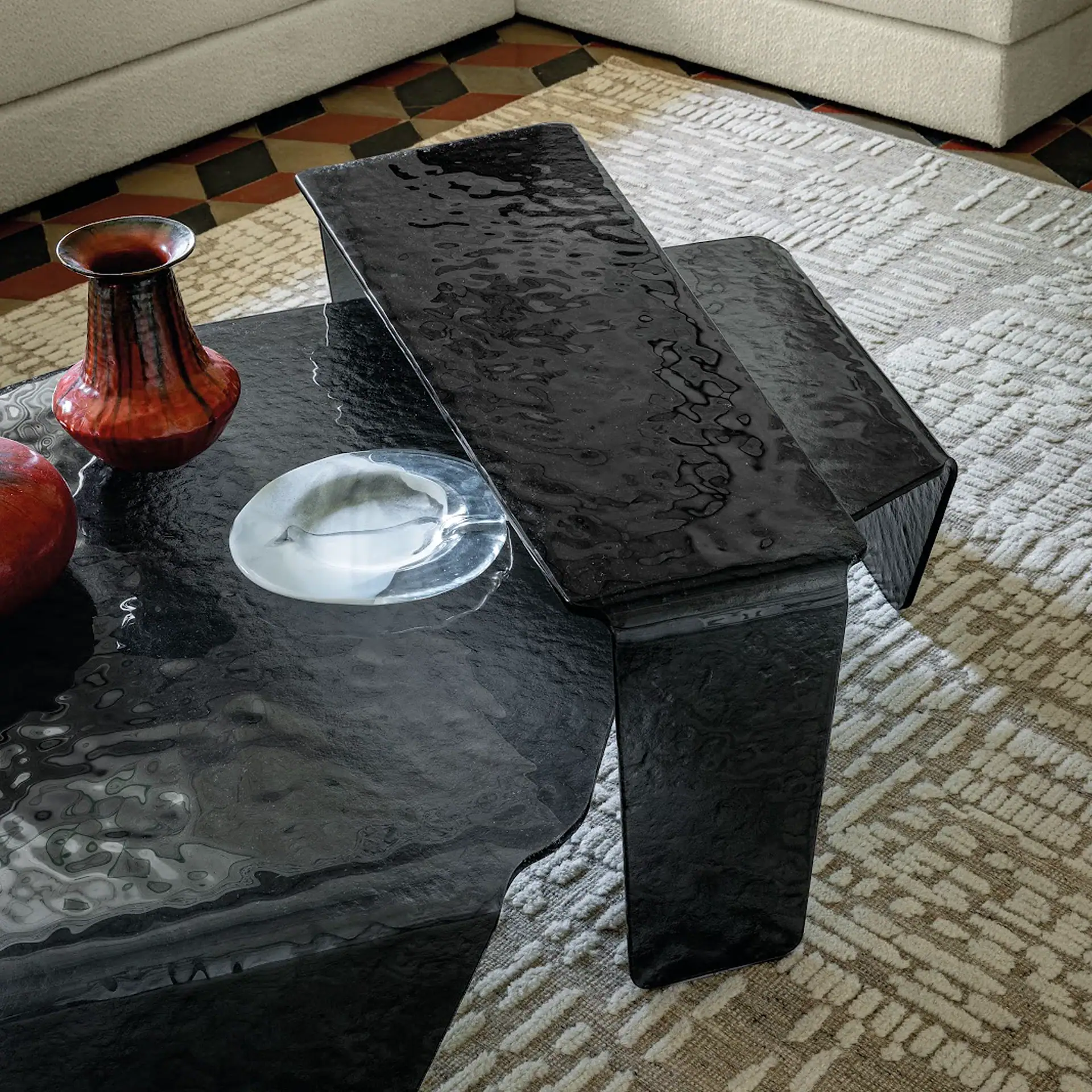 Chimera hammered glass coffee table with black finish in living room.