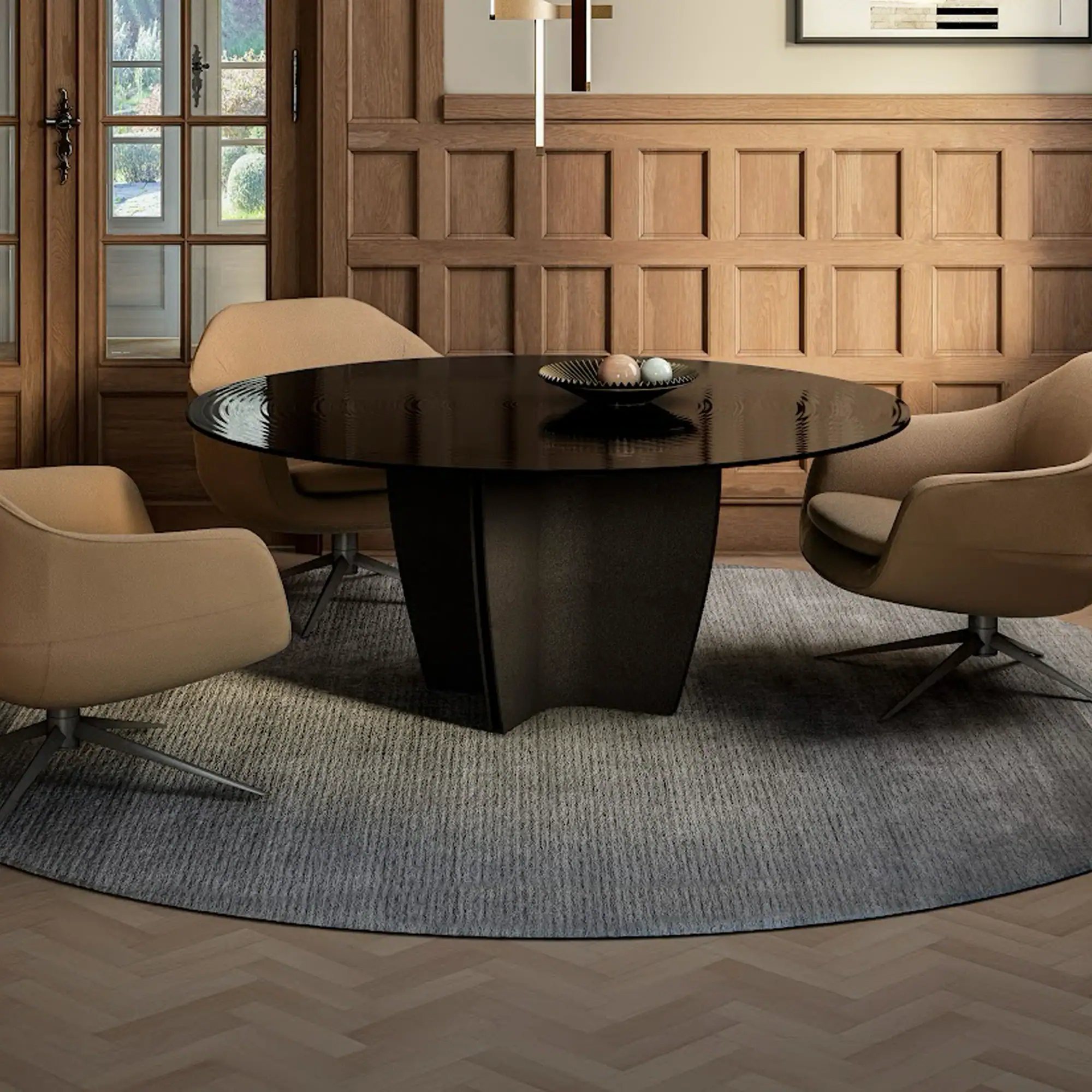 A modern dining room with a dark round table, three tan armchairs, a gray rug, wood-paneled walls, and French doors.
