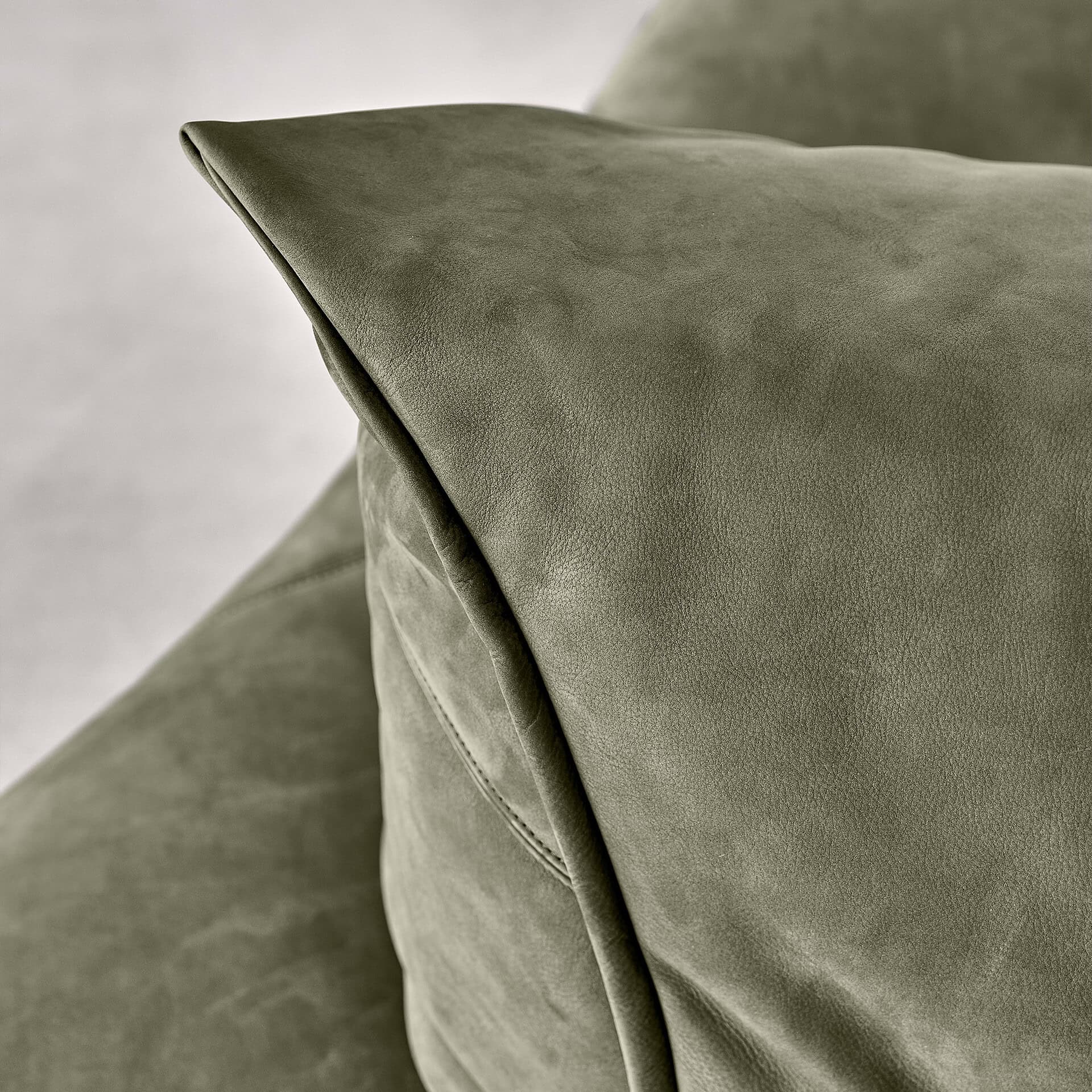 Elegant close-up of the Night Fever Modular Sofa in olive green fabric.