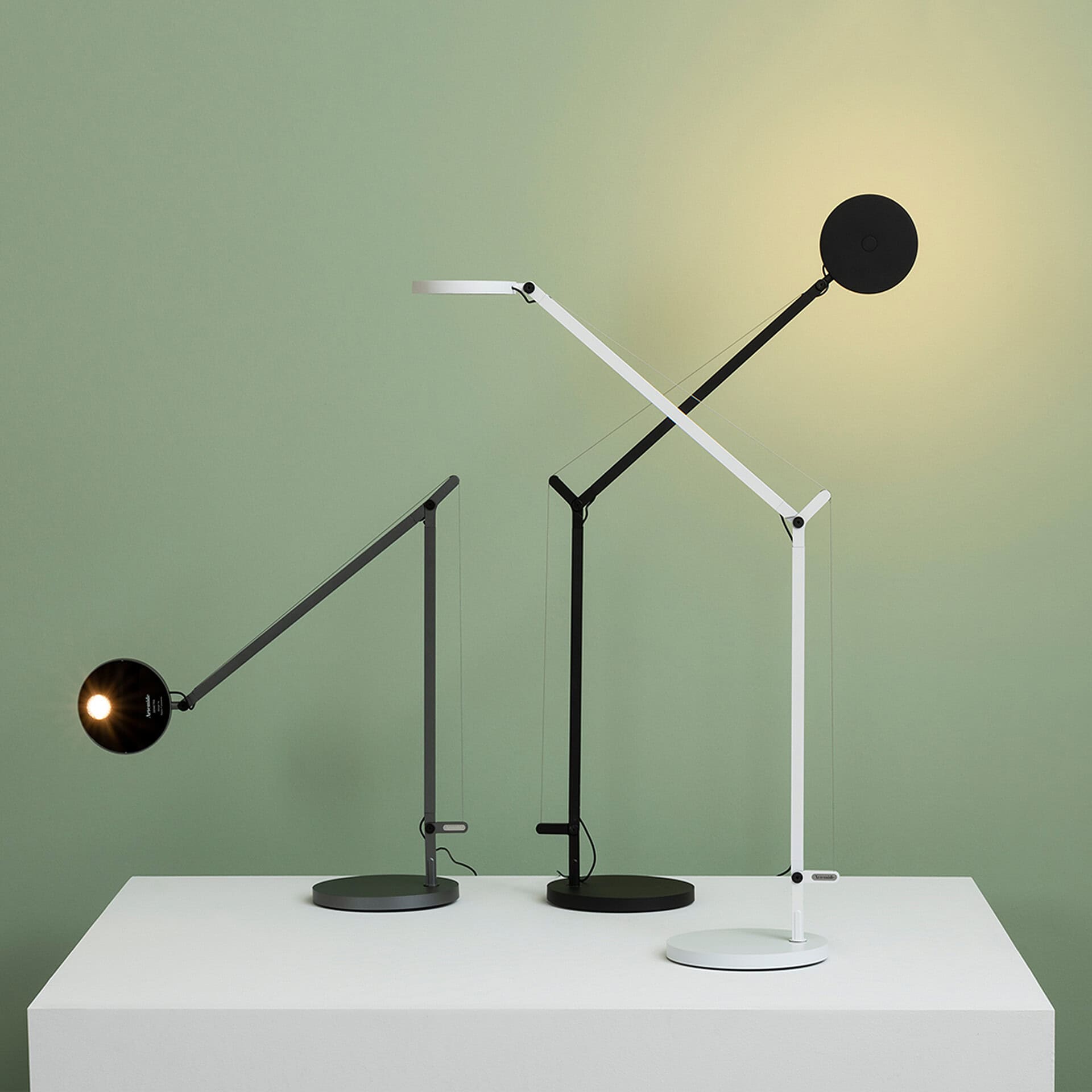 Adjustable table lamps by Sklar Furnishings, perfect for modern home lighting and decor.