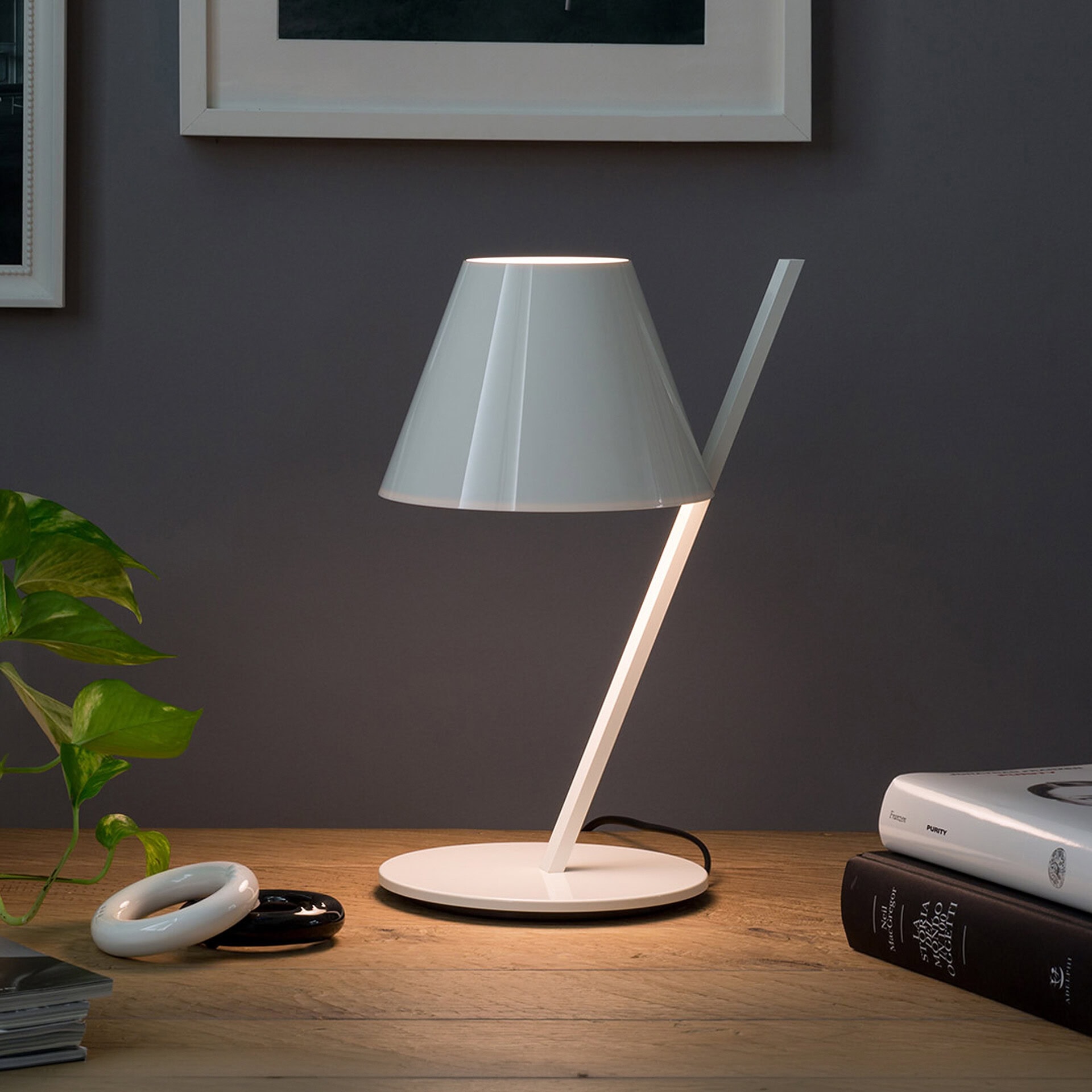 Modern white table lamp with sleek design, perfect for living rooms or bedrooms.