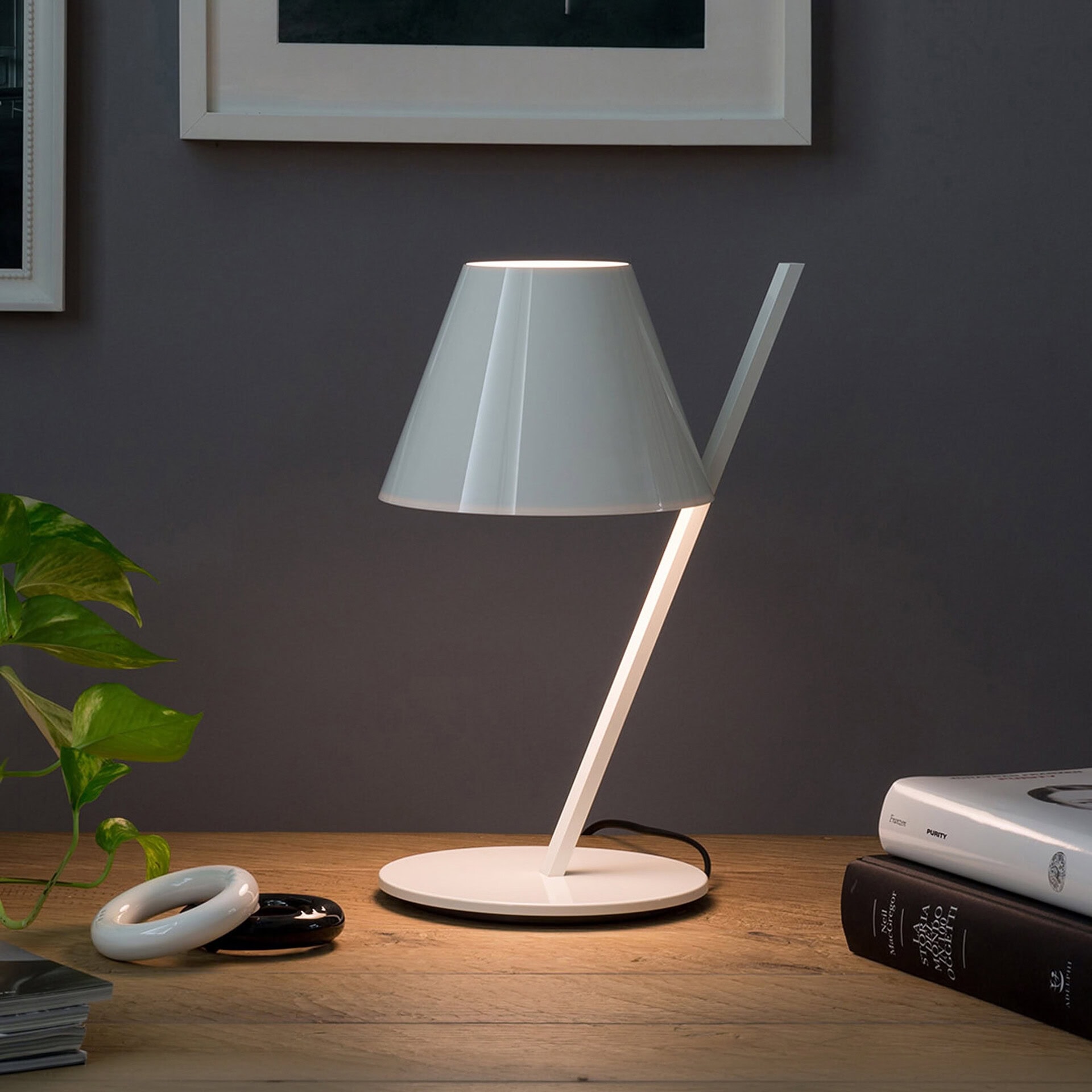 Modern white table lamp with sleek design, perfect for living rooms or bedrooms.