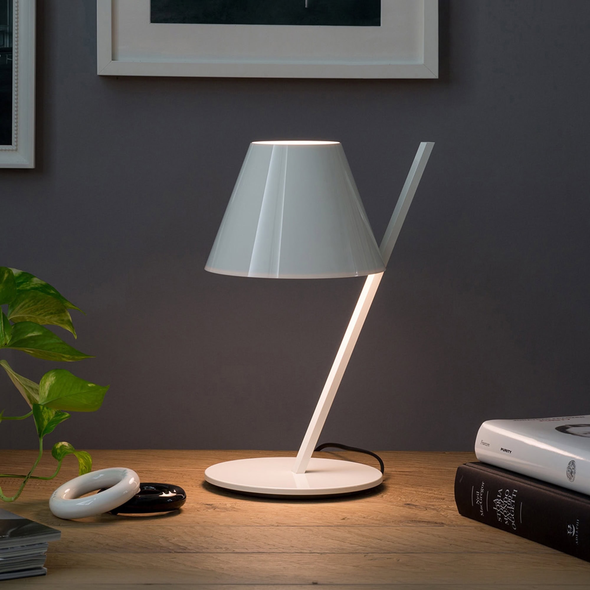 Modern white table lamp with sleek design, perfect for living rooms or bedrooms.