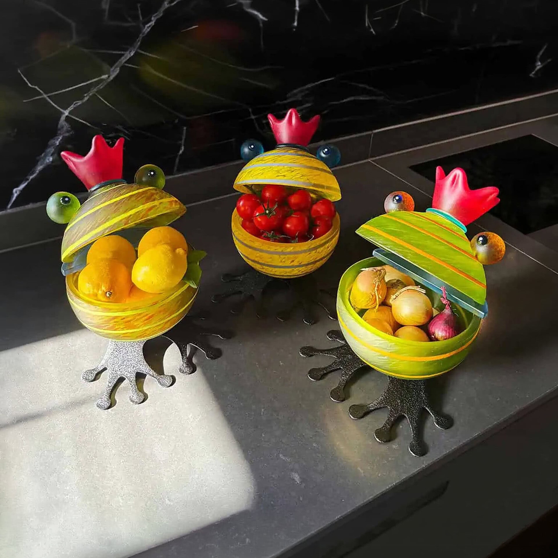 Frog-shaped glass bowls with colorful fruits, decorative and functional for kitchen or dining.