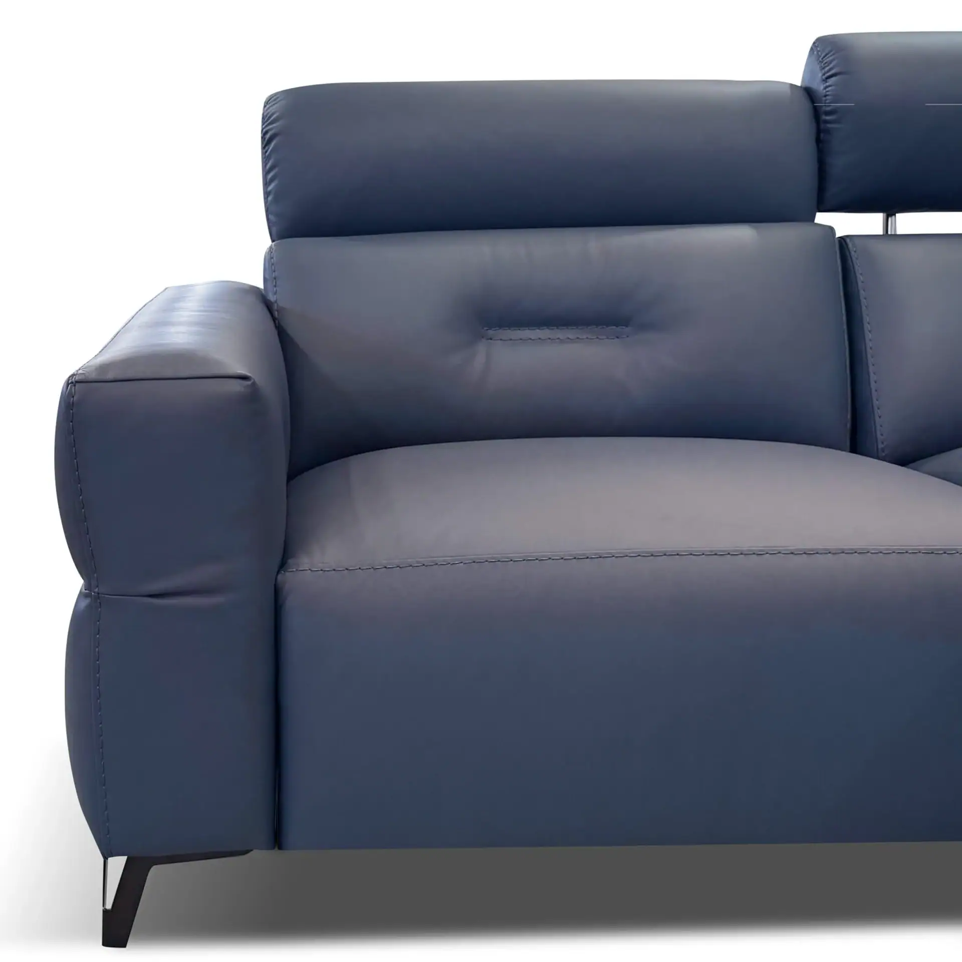 Close-up of a dark blue leather sofa with an adjustable headrest and sleek armrest, set against a white background.