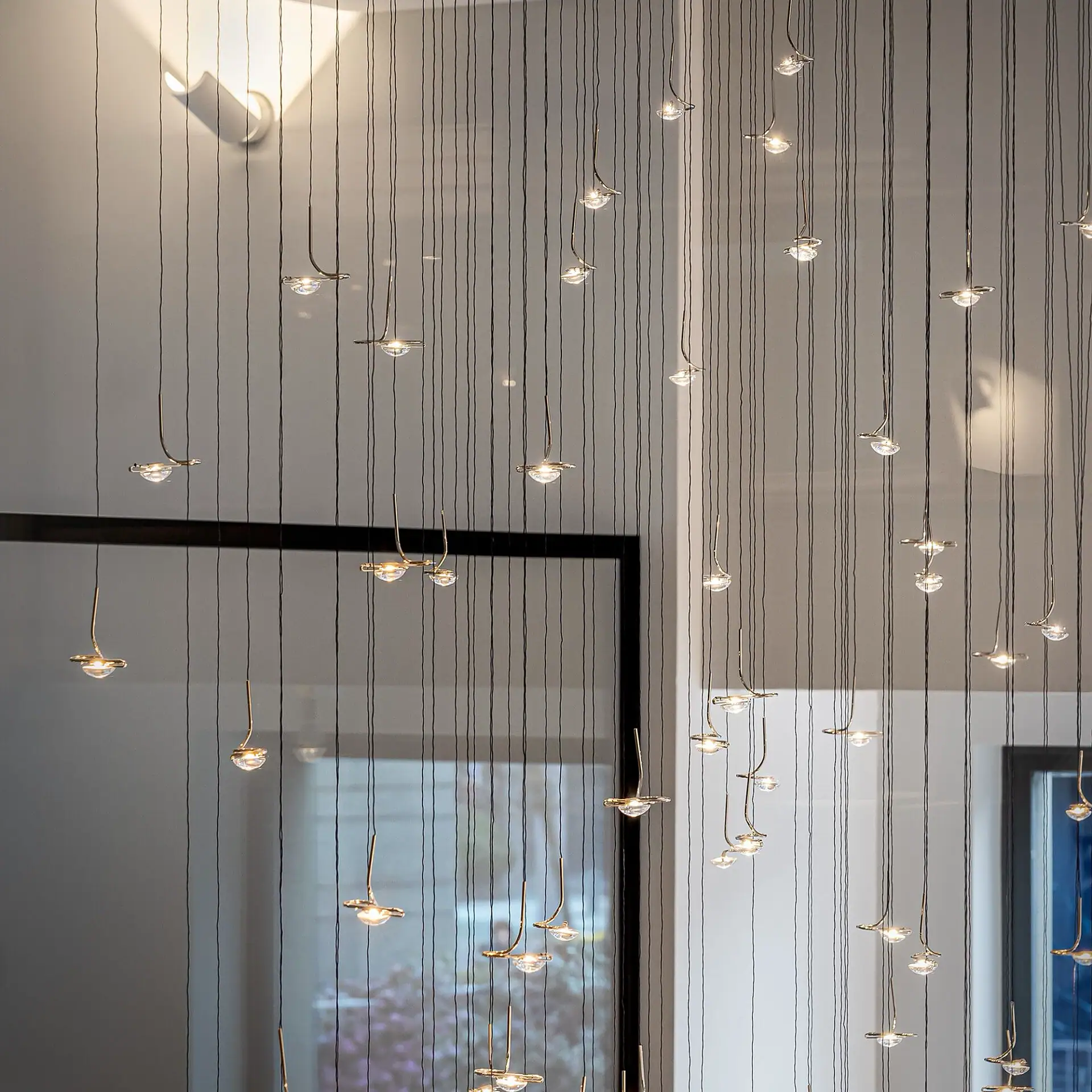 Sklar Furnishings Jackie O Sculptural Chandelier hanging in a modern room.