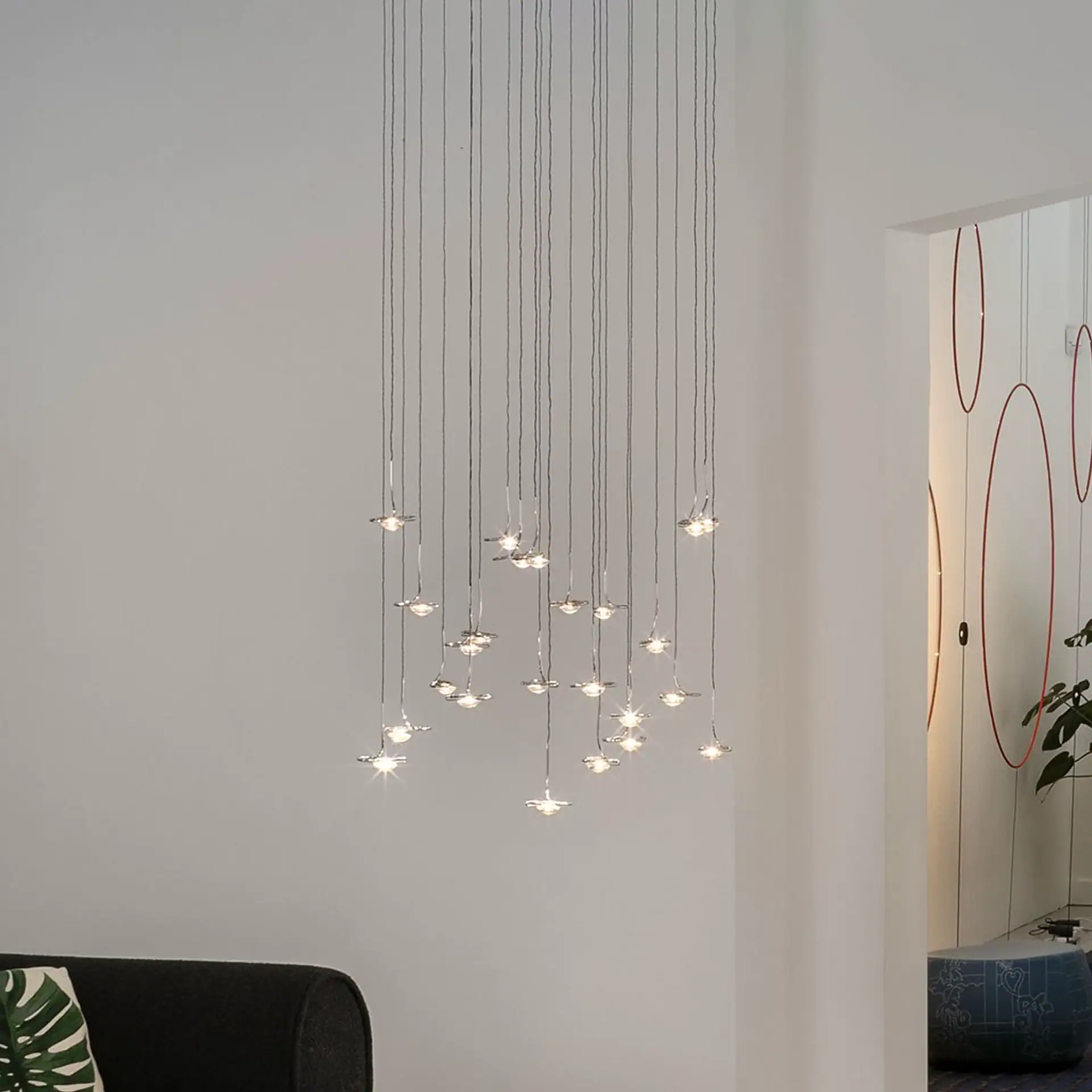 Sklar Furnishings Jackie O Sculptural Chandelier hanging in a modern room.
