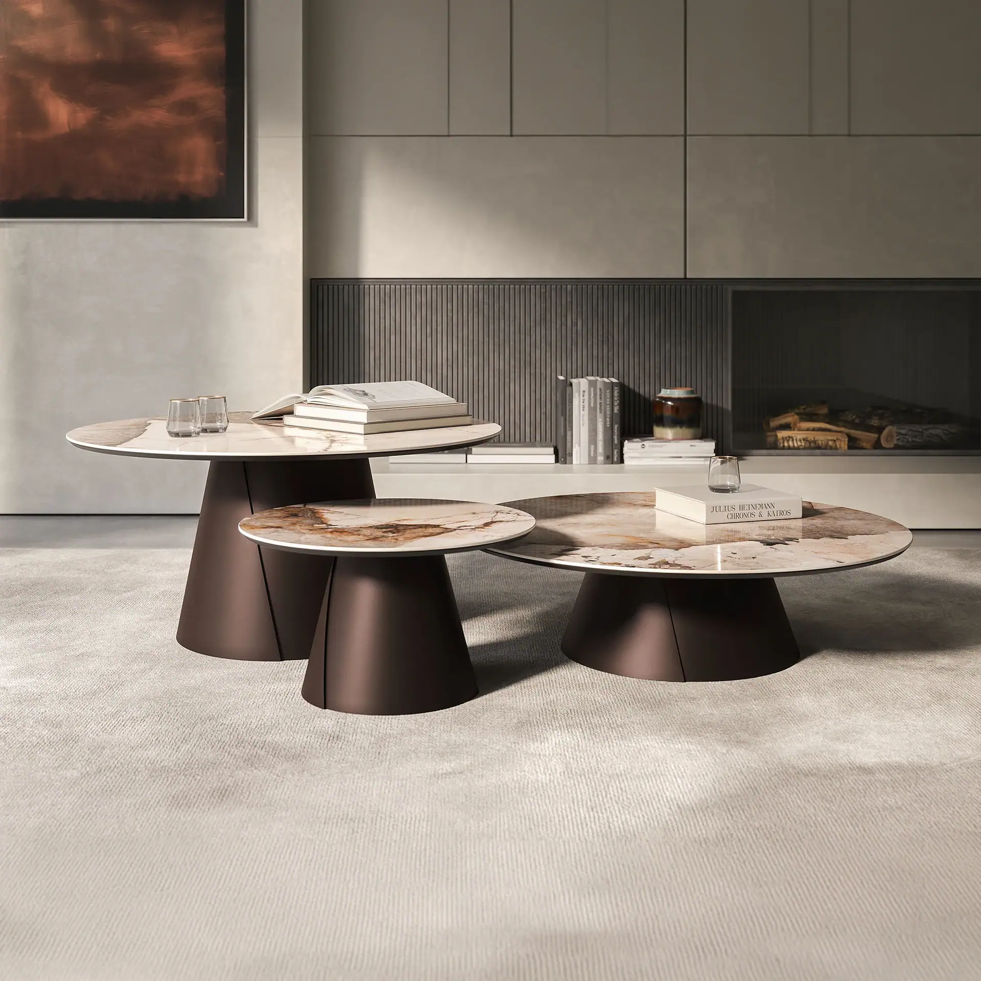 Contemporary marble coffee tables with dark bases in stylish living room setting.